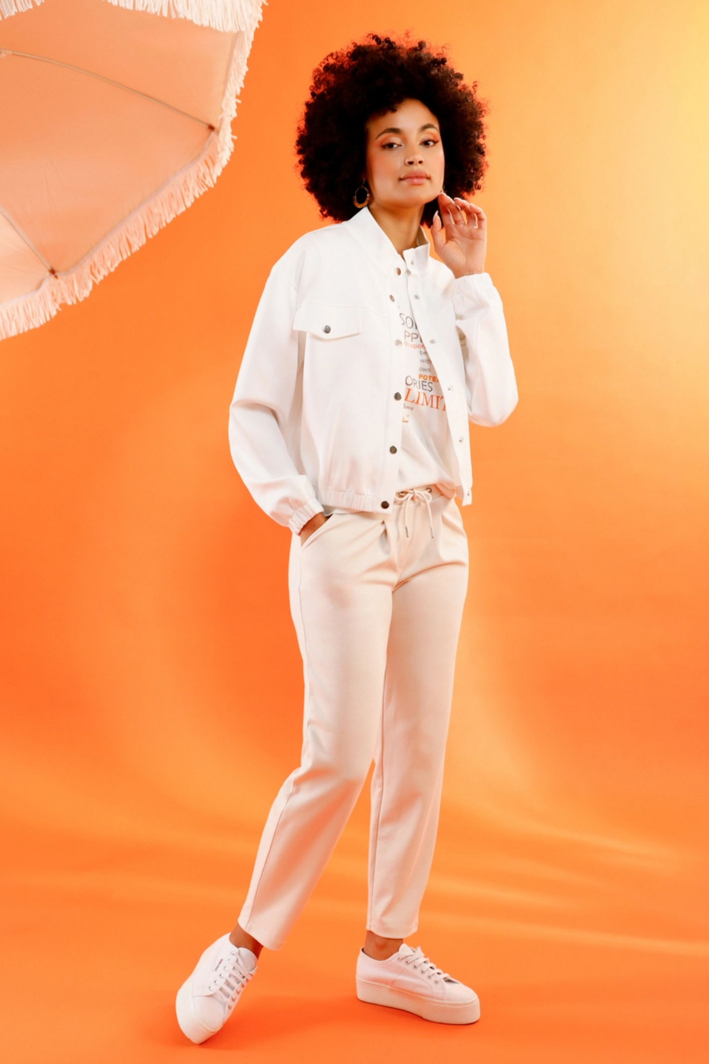 Monari 410465 Drawstring Sweatpants Champagne Beige worn by model with white jacket and sneakers, shop Monari at Dotique