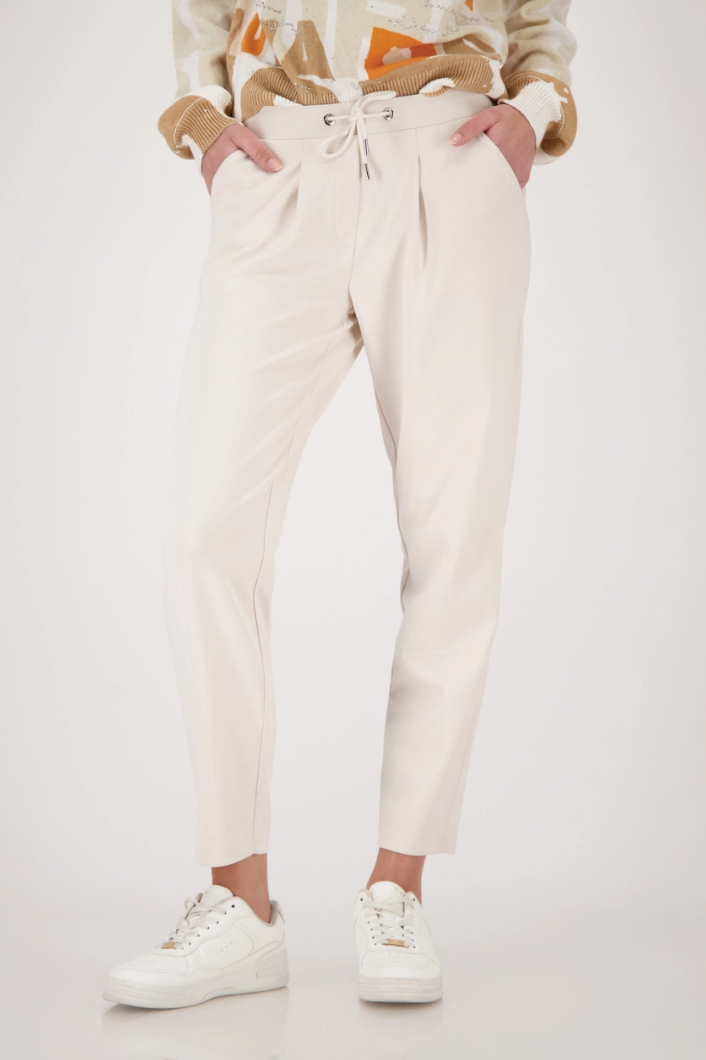 Monari 410465 Drawstring Sweatpants Champagne Beige by Monari shown worn, shop Monari at Dotique for stylish comfort.