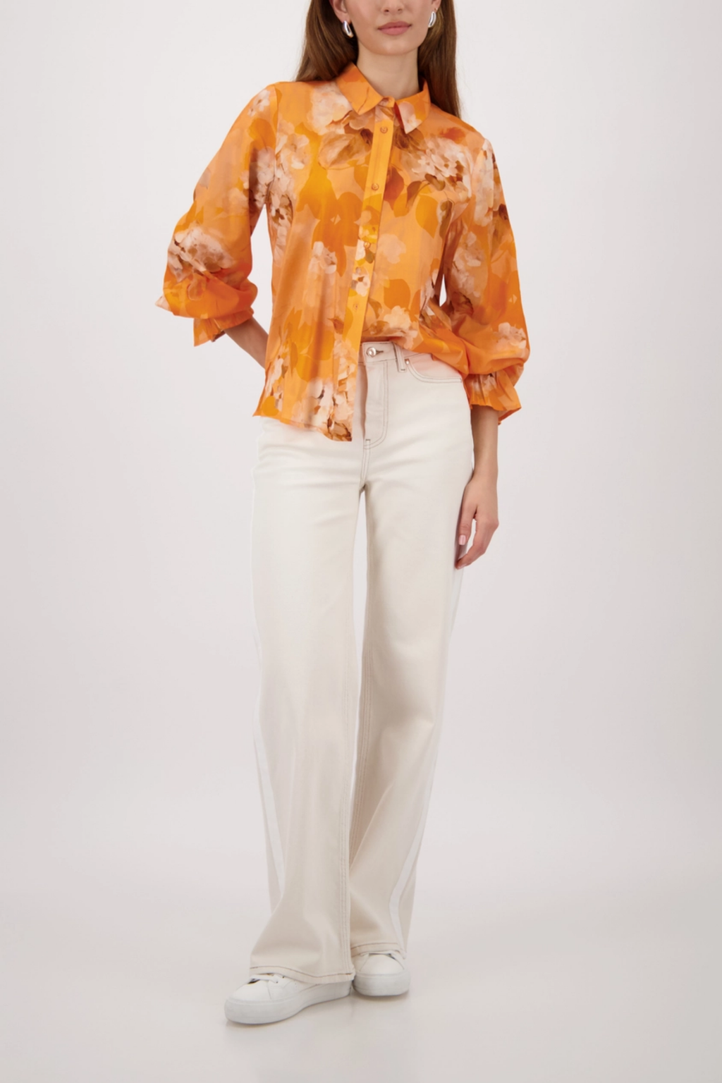 Monari 410259 Floral Pattern Blouse Aperitif in vibrant orange worn with white pants, shop Monari at Dotique.