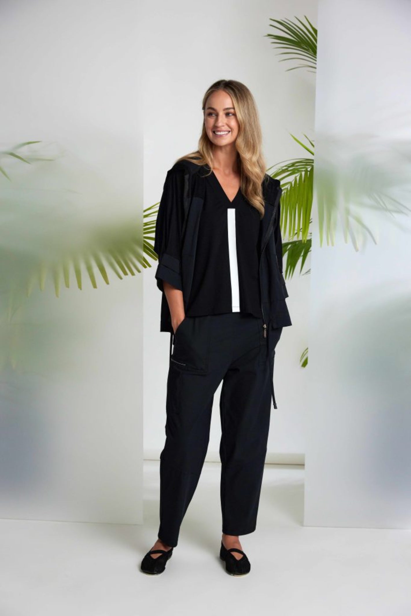 Naya NAS26196 Drawstring Hem Zip Jacket With Contrast Panels Black by Naya modeled with casual black outfit Shop Naya at Dotique