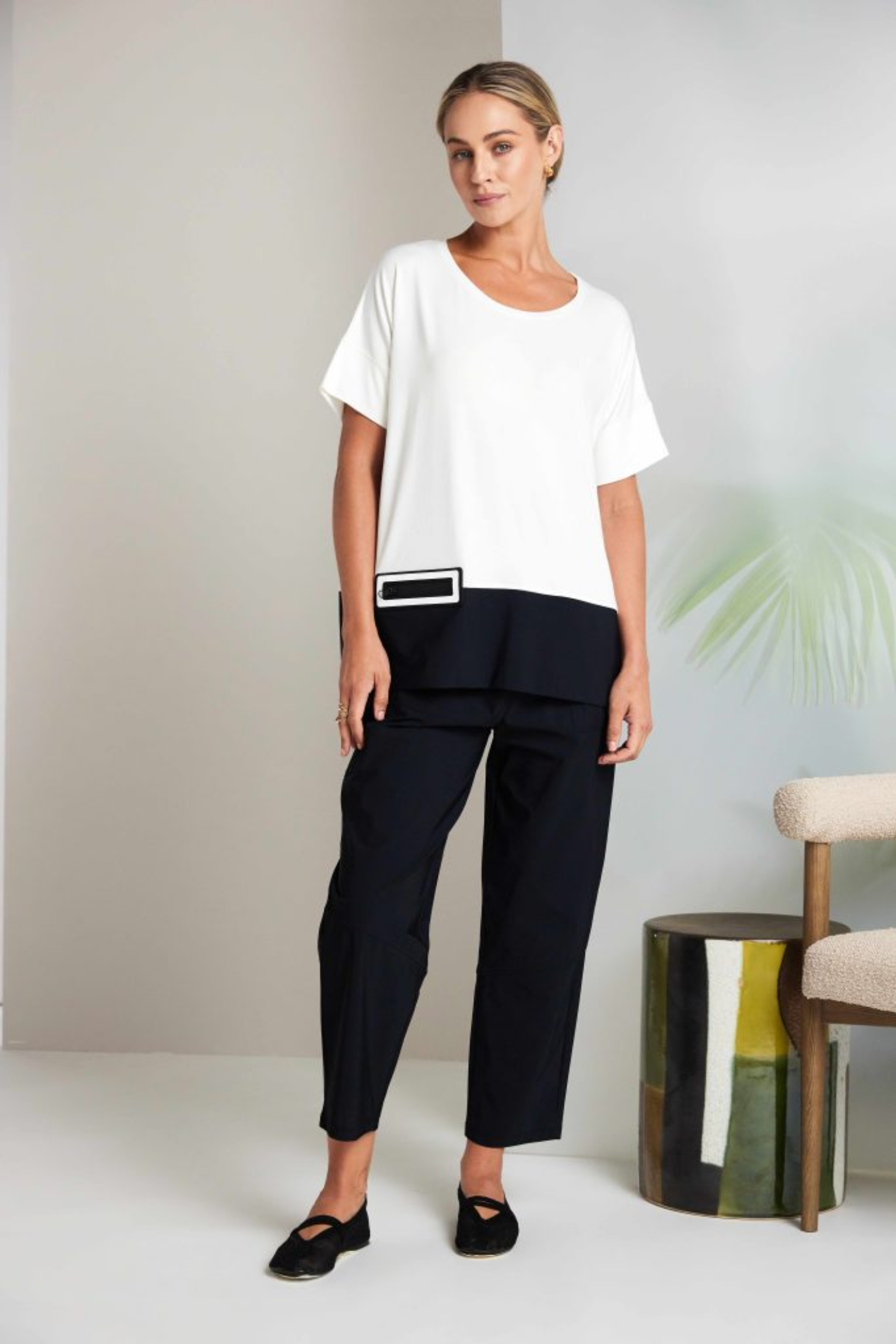 Black Naya pull-up trousers with a slim leg, stretch fabric and patch pockets. Comfortable, flattering and easy to wear. Shop now at Dotique.