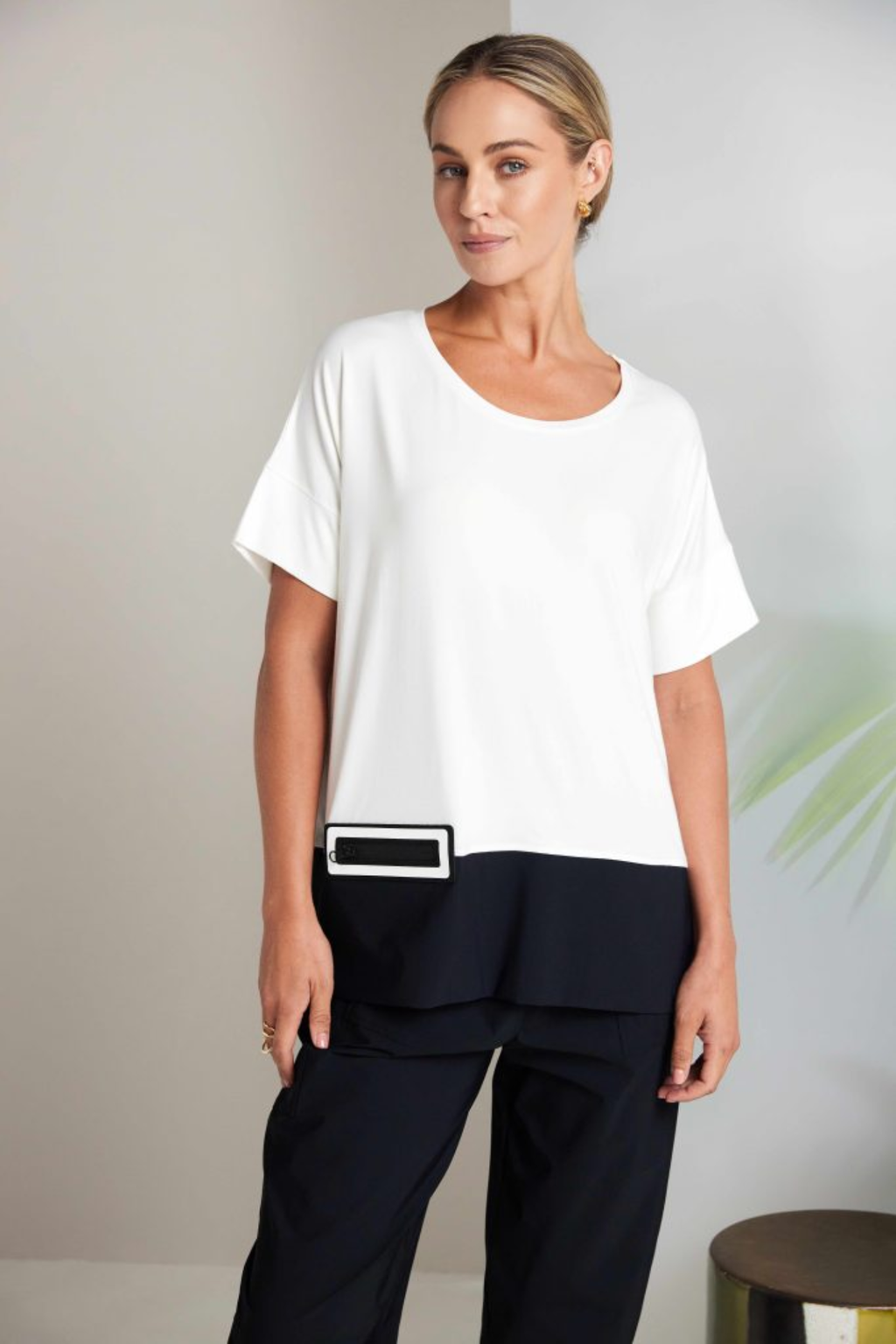 Black Naya pull-up trousers with a slim leg, stretch fabric and patch pockets. Comfortable, flattering and easy to wear. Shop now at Dotique.