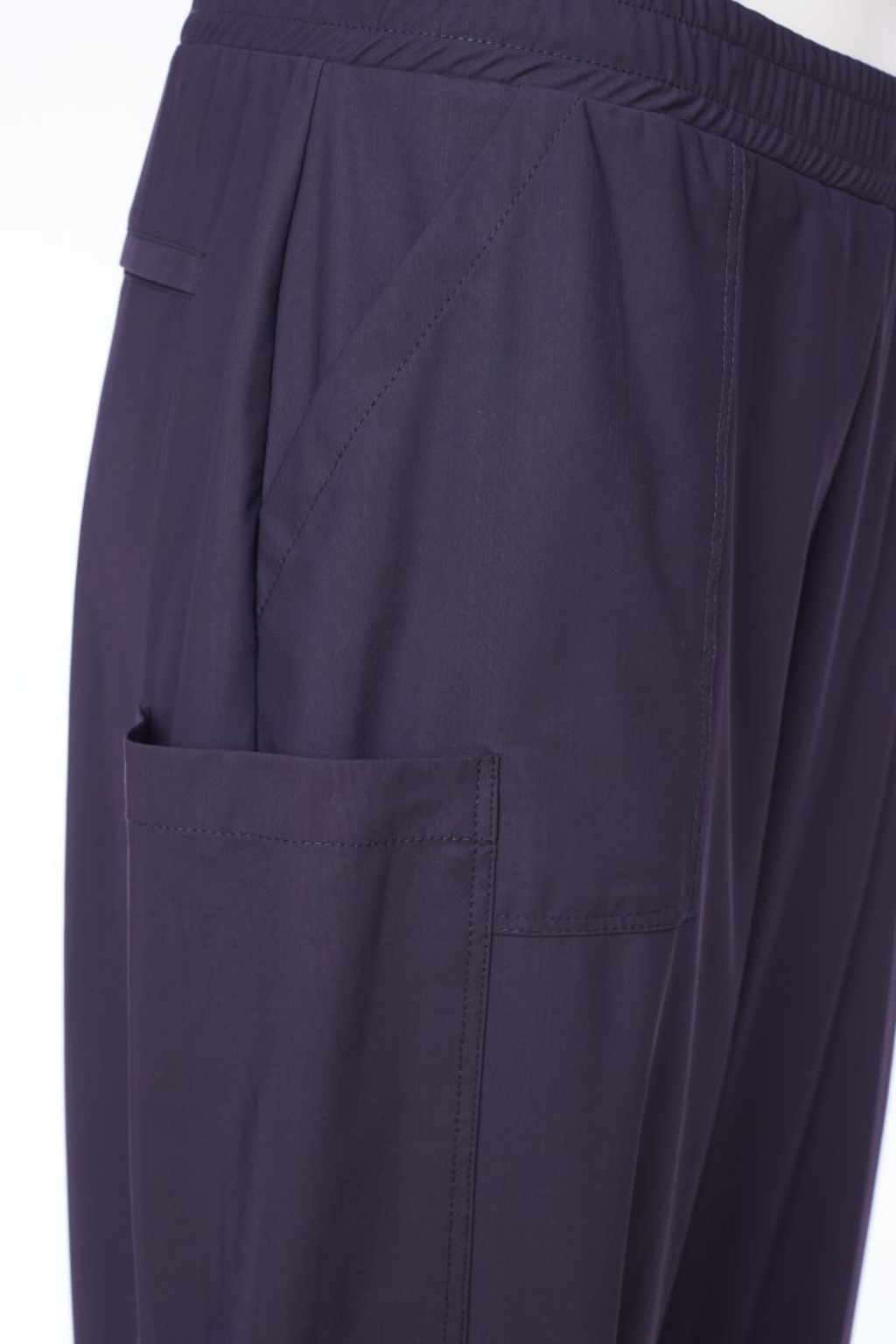 Black Naya pull-up trousers with a slim leg, stretch fabric and patch pockets. Comfortable, flattering and easy to wear. Shop now at Dotique.