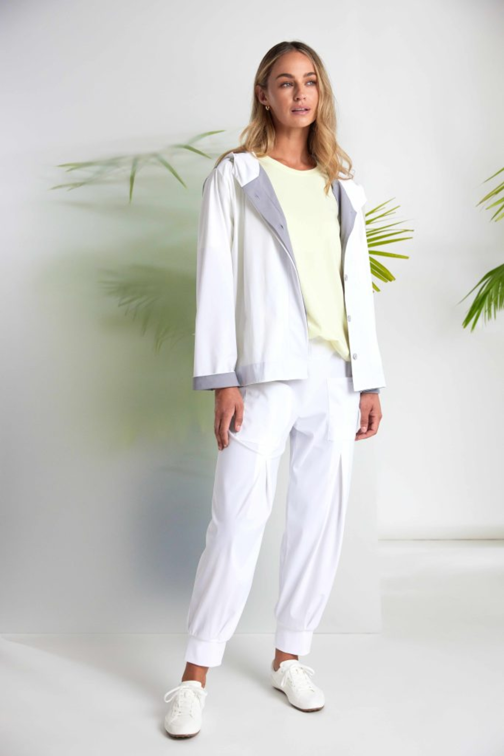 Soft lemon yellow Naya jersey top with a relaxed fit and cut-out hem detail. Easy to wear and perfect for everyday. Shop at Dotique.