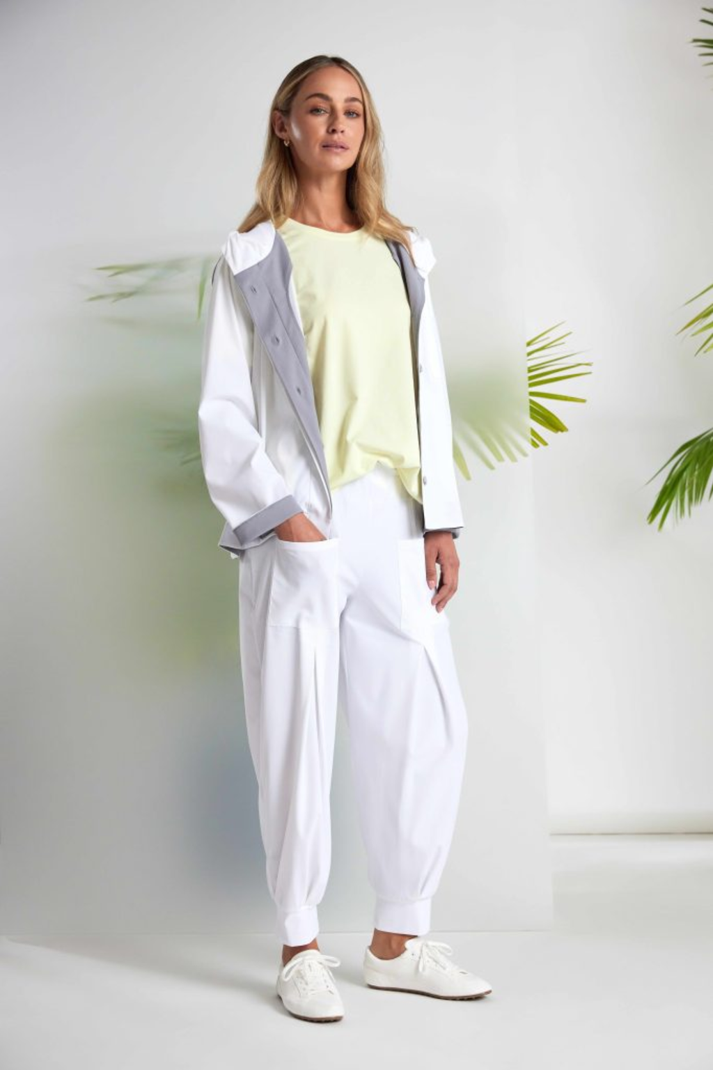 Soft lemon yellow Naya jersey top with a relaxed fit and cut-out hem detail. Easy to wear and perfect for everyday. Shop at Dotique.