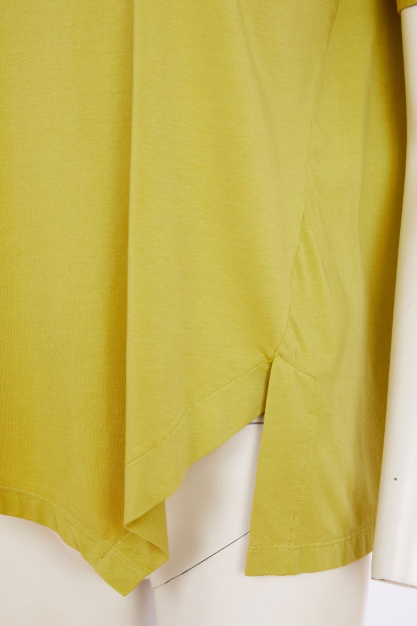 Naya Oasis jersey top with a relaxed fit and cut-out hem detail. Soft, flattering and easy to wear. Shop this fresh colour at Dotique.