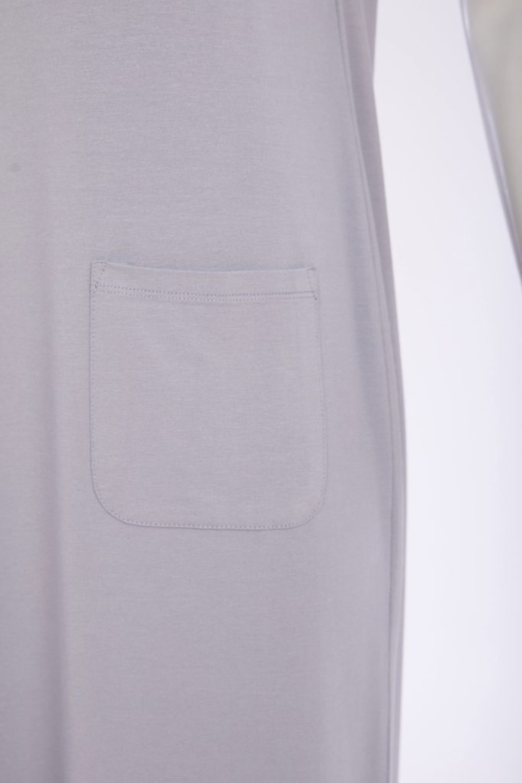 Soft dove grey Naya jersey dress with wide straps, side slit and patch pocket. Flattering, comfortable and easy to wear. Shop at Dotique.