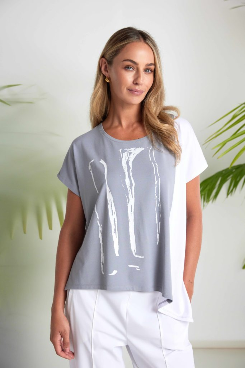 Dove grey and white Naya print top with contrast side panel and asymmetric hem. Soft jersey, flattering and easy to wear. Shop at Dotique.