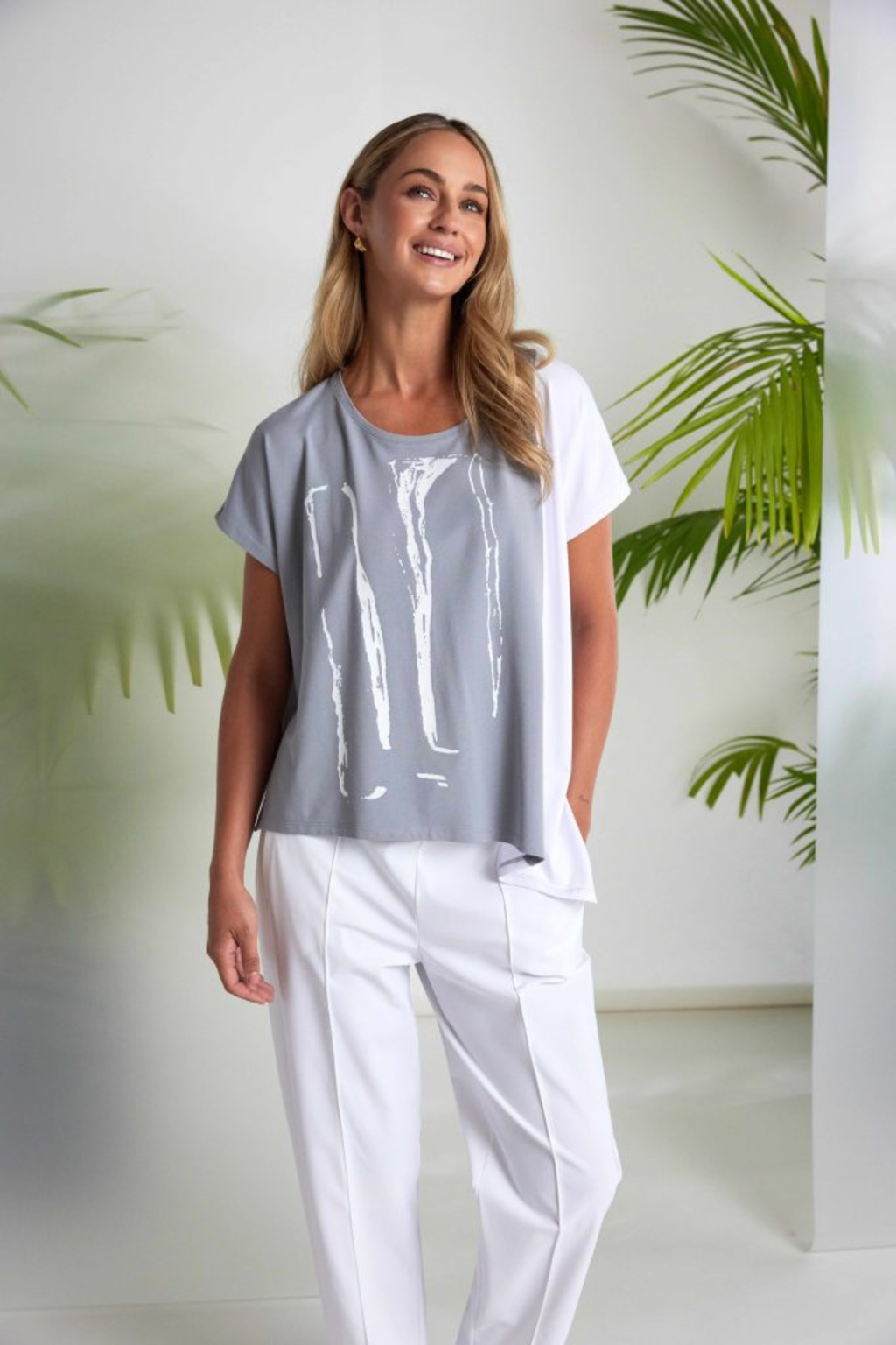Dove grey and white Naya print top with contrast side panel and asymmetric hem. Soft jersey, flattering and easy to wear. Shop at Dotique.