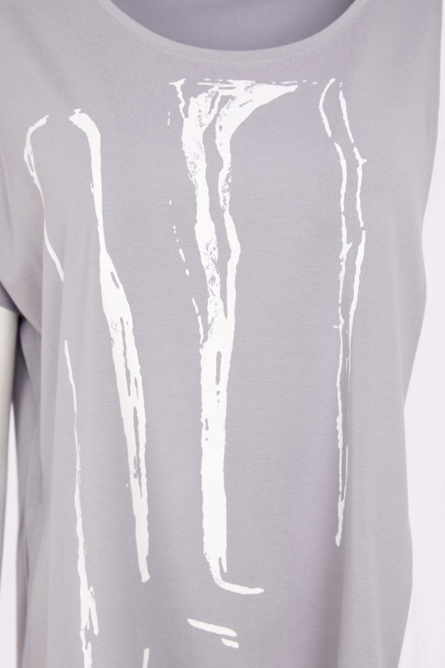 Dove grey and white Naya print top with contrast side panel and asymmetric hem. Soft jersey, flattering and easy to wear. Shop at Dotique.