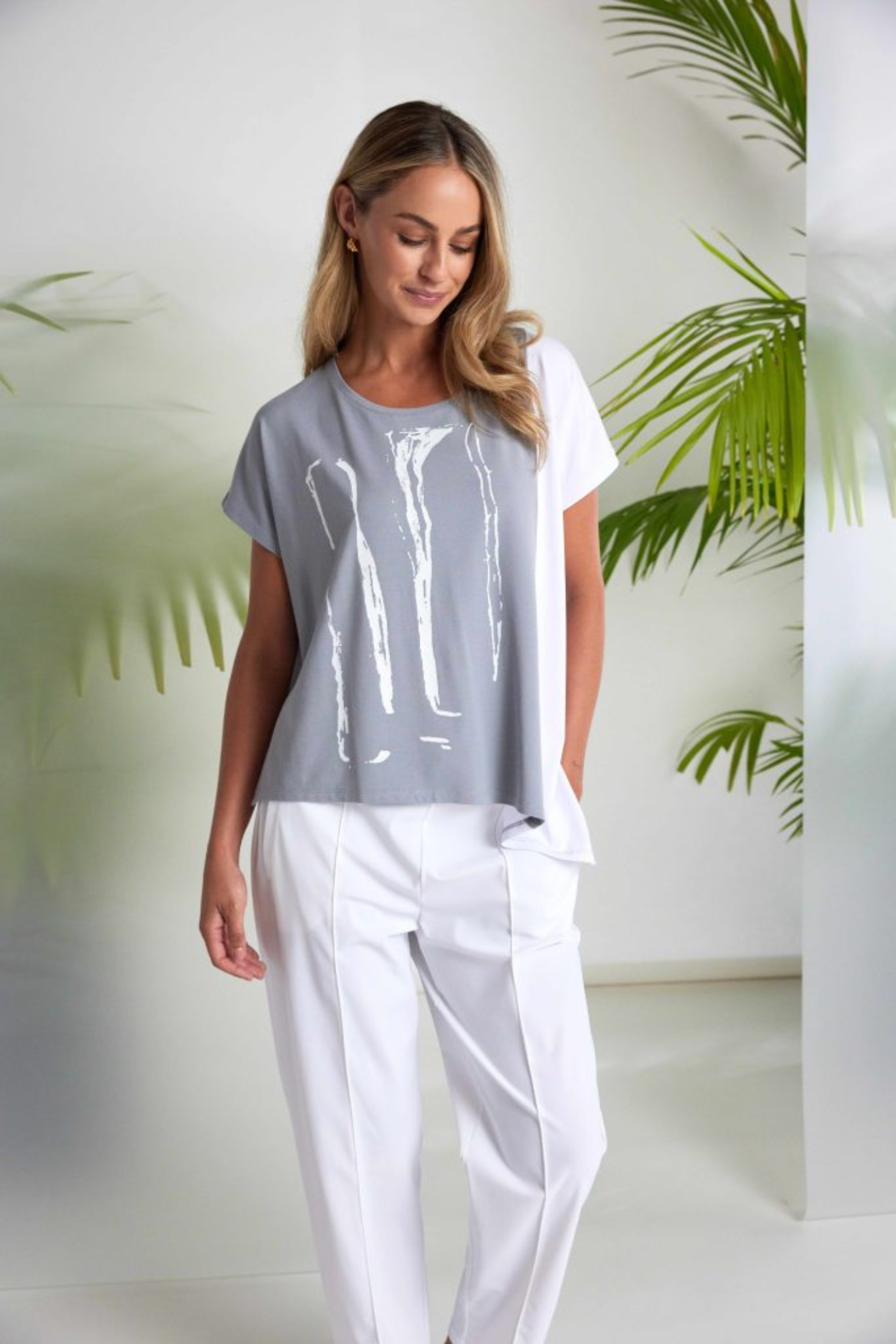 Dove grey and white Naya print top with contrast side panel and asymmetric hem. Soft jersey, flattering and easy to wear. Shop at Dotique.