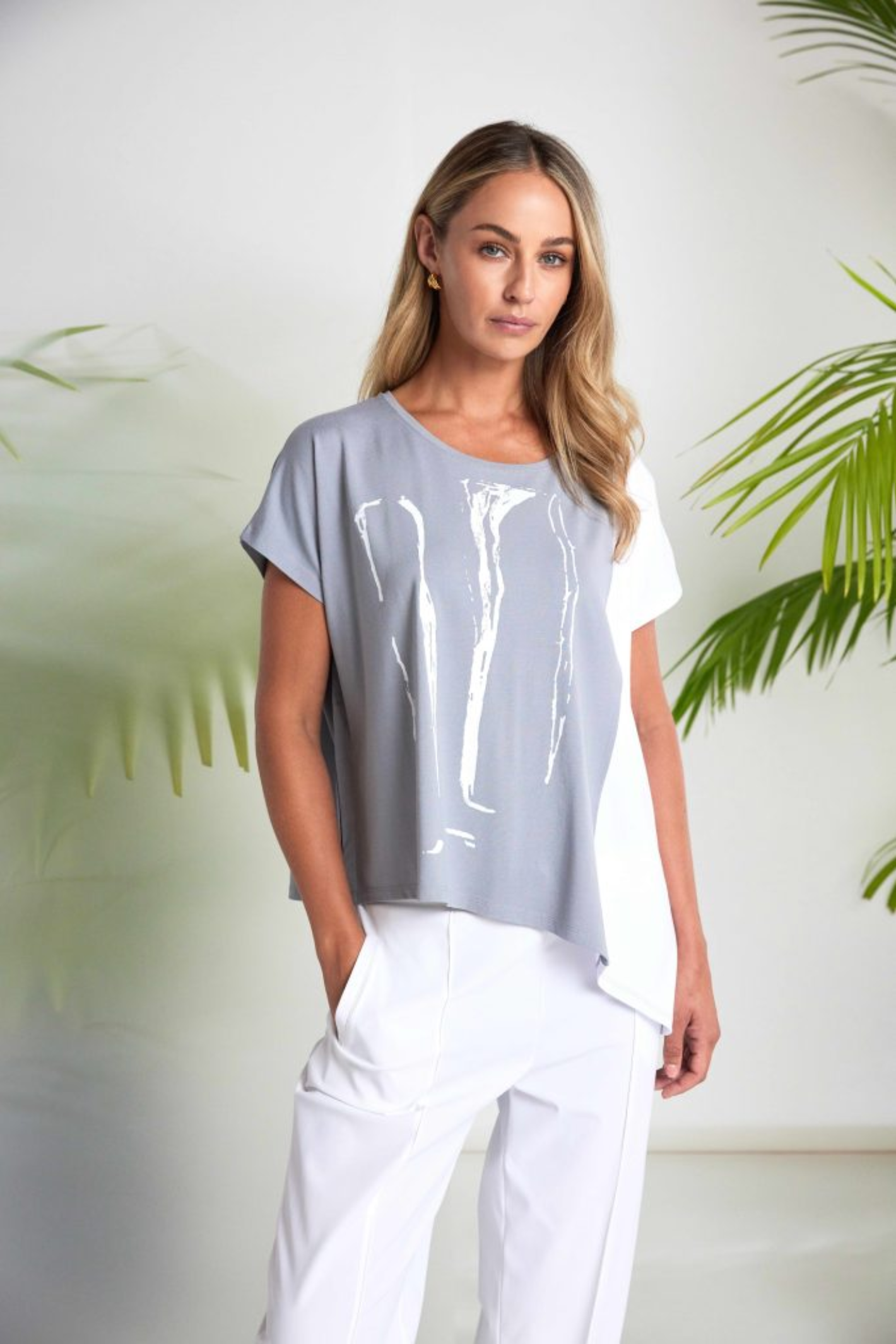 Dove grey and white Naya print top with contrast side panel and asymmetric hem. Soft jersey, flattering and easy to wear. Shop at Dotique.