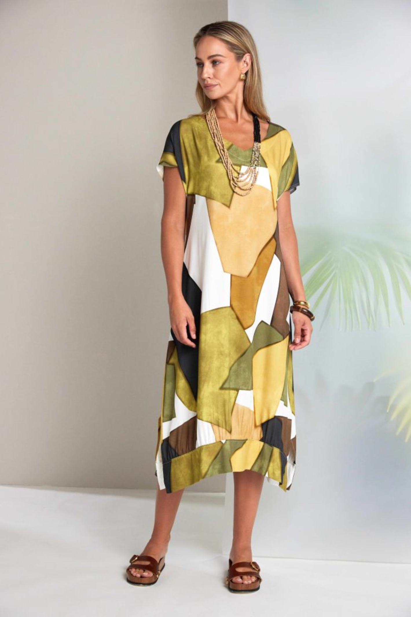 Model wearing Naya NAS26151 Oasis Multicolour V-Neck Dress by Naya, shop Naya at Dotique in bold abstract block print style