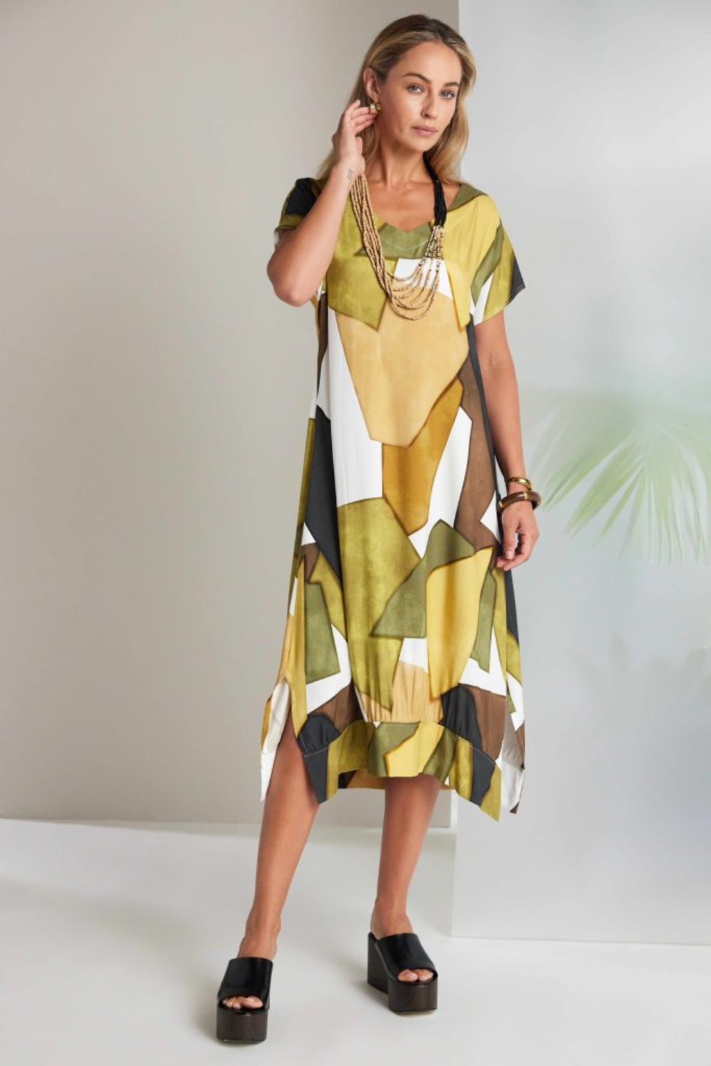Model wearing Naya NAS26151 Oasis Multicolour V-Neck Dress by Naya in abstract block print, shop Naya at Dotique