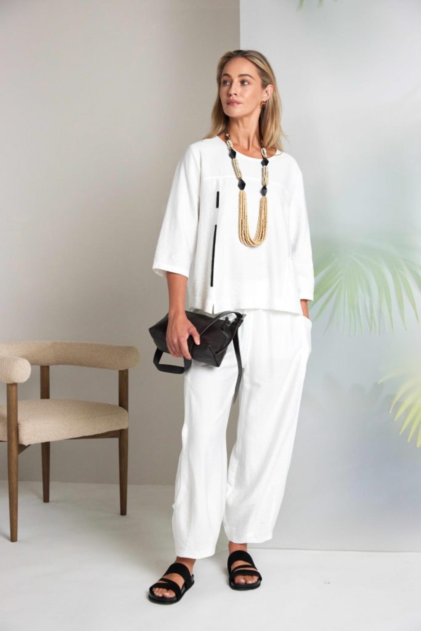 Model wearing Naya NAS26153 White Pull-On Trousers by Naya, shop Naya styles at Dotique for refined casual looks