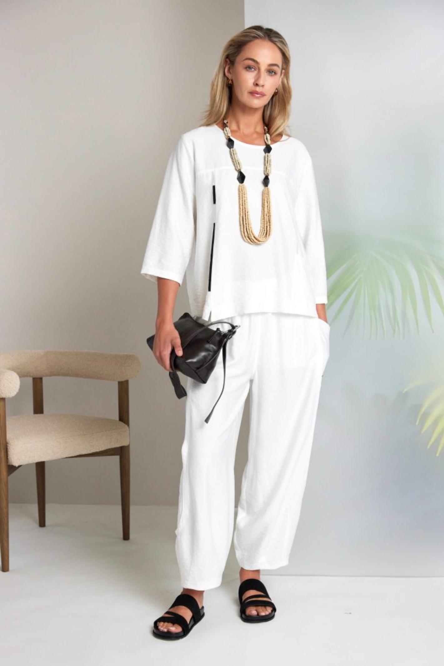 Model wearing Naya NAS26153 White Pull-On Trousers by Naya, shop Naya styles at Dotique for effortless relaxed elegance