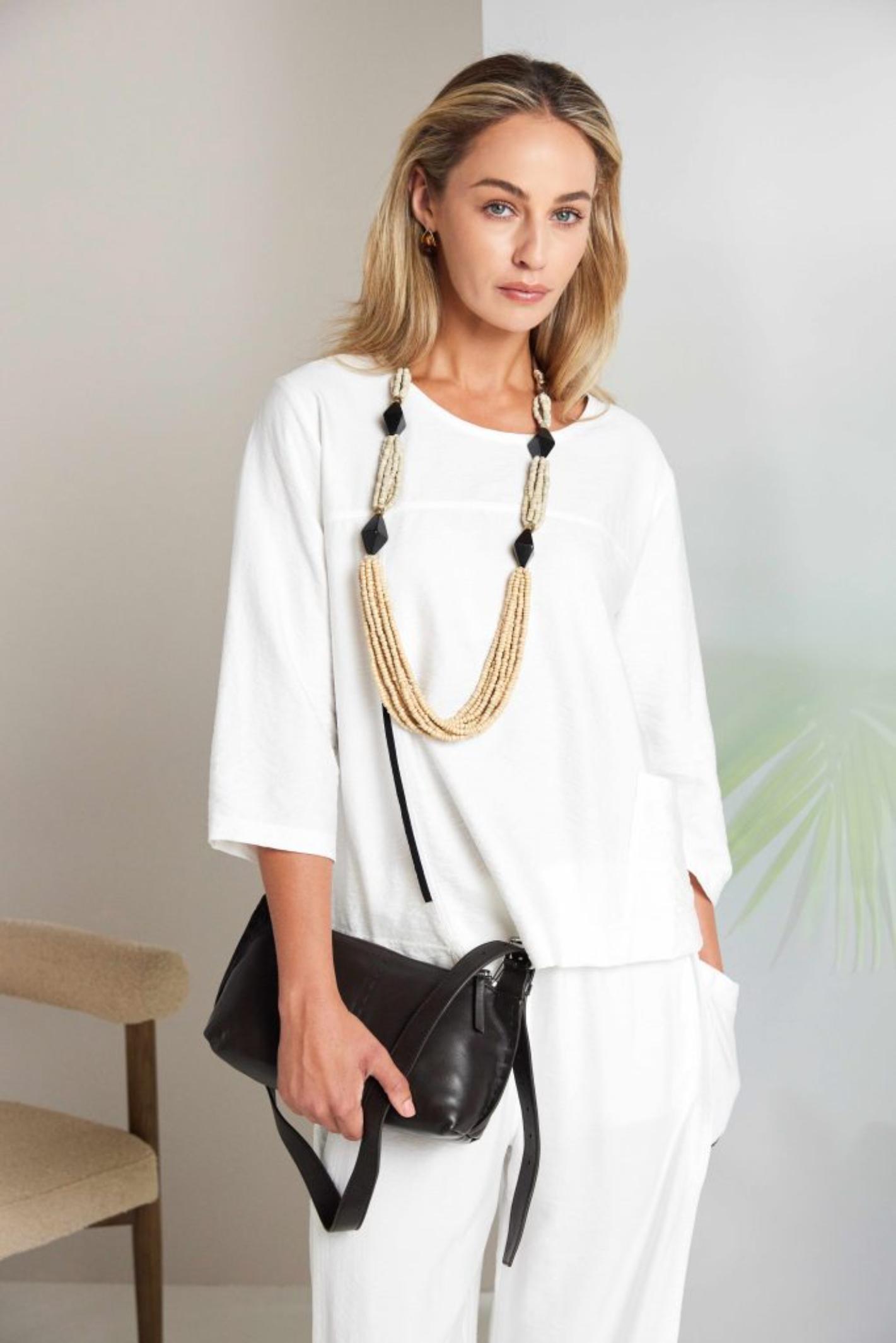 Model wearing Naya NAS26153 White Pull-On Trousers by Naya, shop Naya styles for relaxed chic looks at Dotique