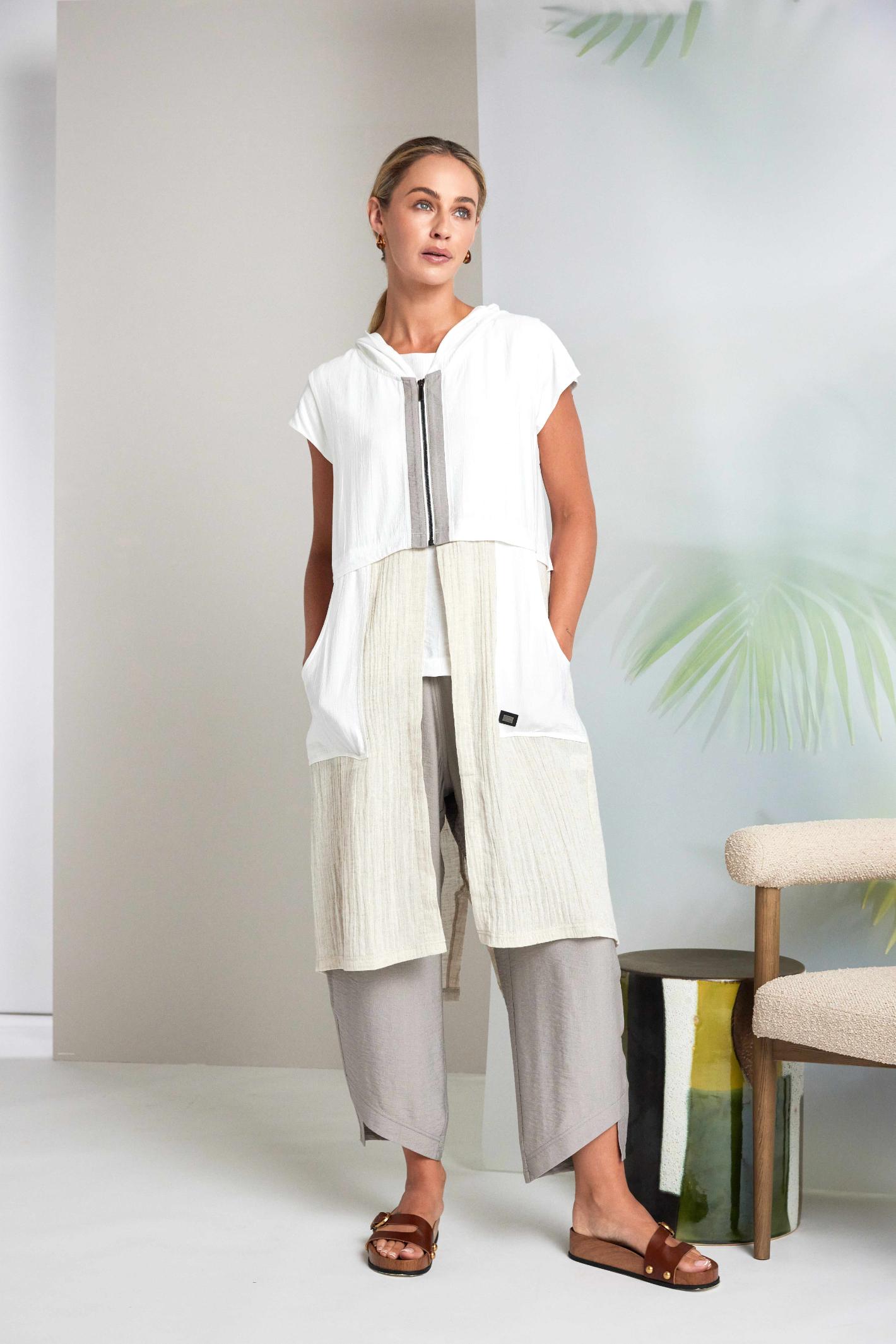 Model wearing Naya NAS26157 Hooded Longline Waistcoat with Zip in Pebble by Naya, shop Naya styles at Dotique for layered looks