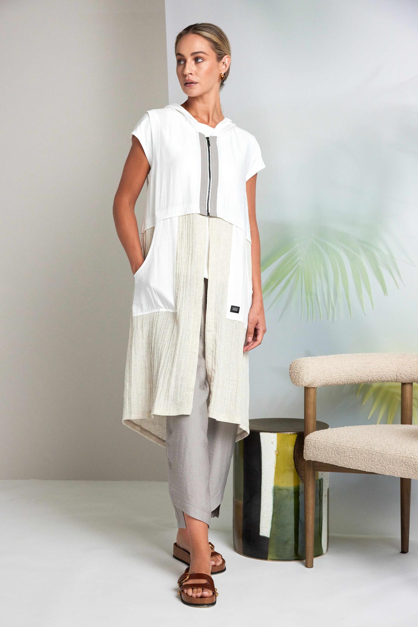 Model wearing Naya NAS26157 Hooded Longline Waistcoat with Zip in Pebble by Naya, shop Naya styles at Dotique for light layering.
