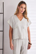 Model wearing Naya NPA26220 Patch Pocket Vee Neck Top With Button Detail Ash by Naya, styled minimally. Shop Naya at Dotique.