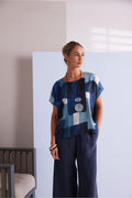 NAYA blue multi abstract print top featuring a round neckline, short sleeves and an artistic patchwork design.