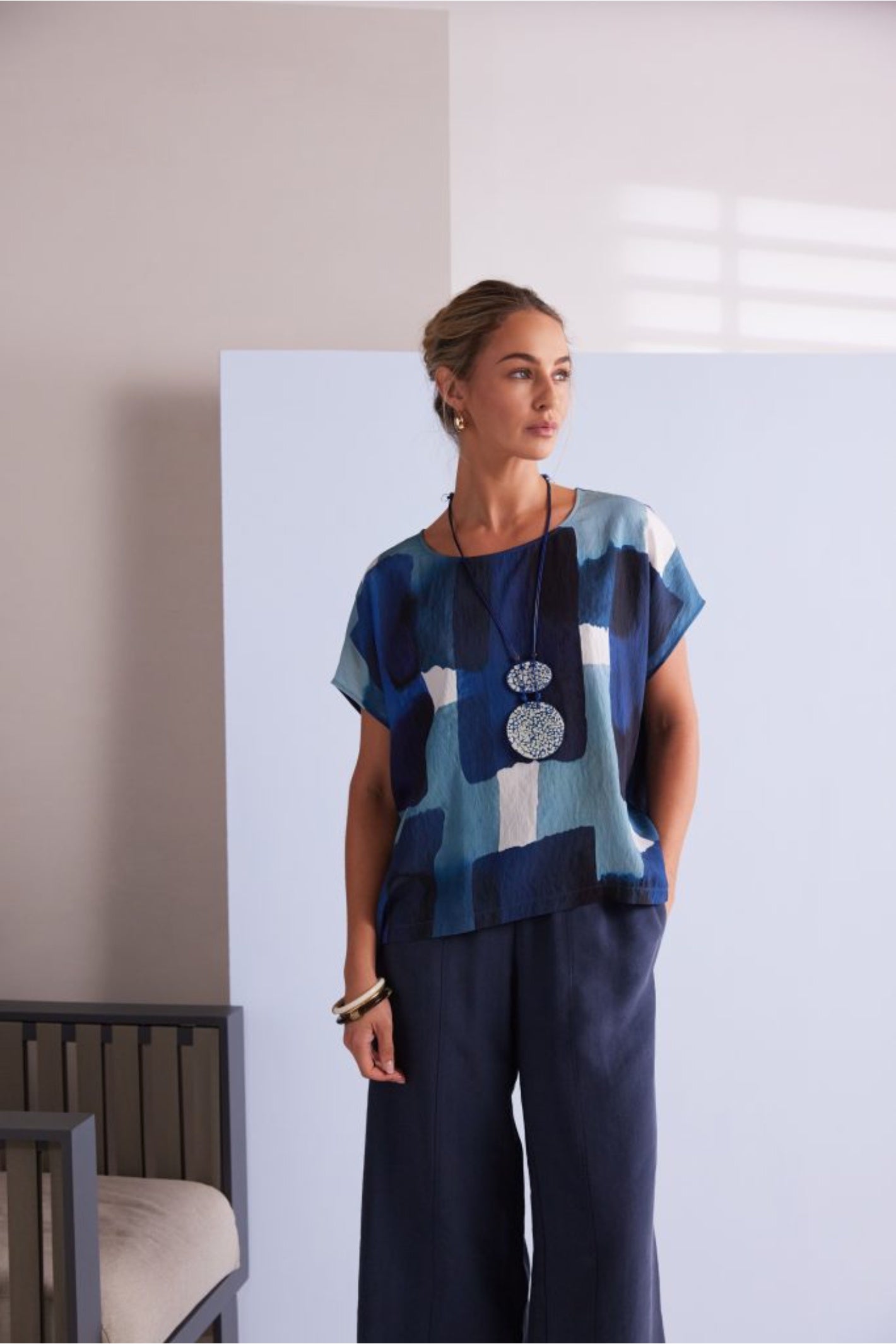 NAYA blue multi abstract print top featuring a round neckline, short sleeves and an artistic patchwork design.