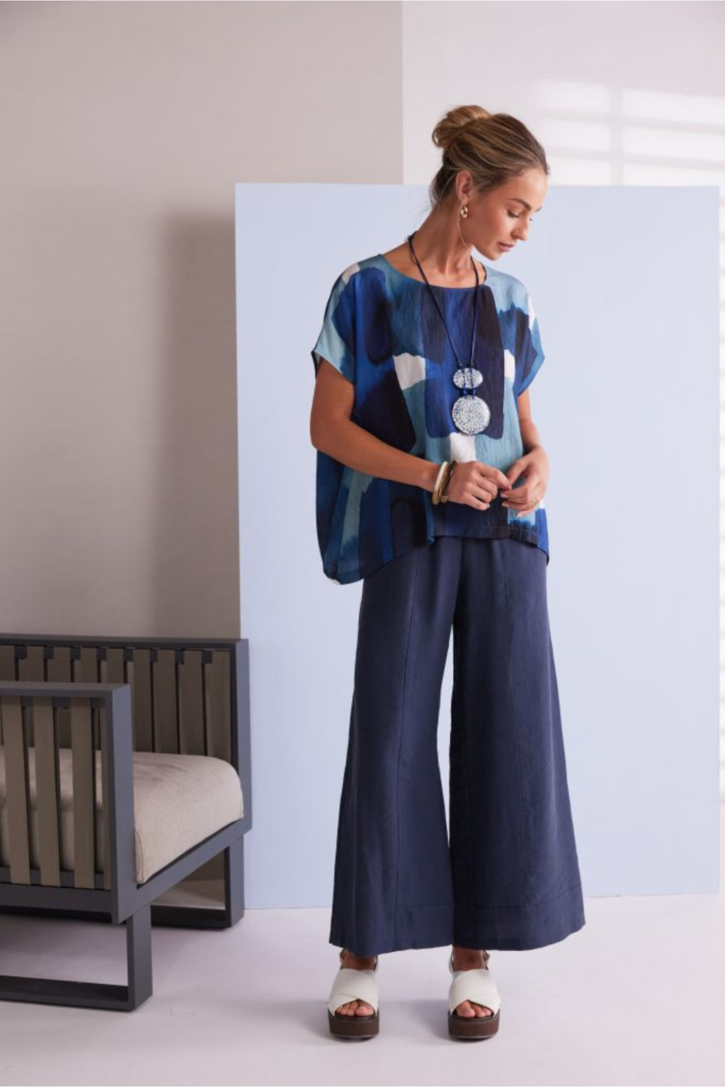 NAYA blue multi abstract print top featuring a round neckline, short sleeves and an artistic patchwork design.