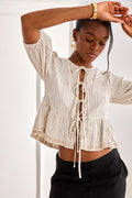 Model wearing NKN Nekane Tili Ivory Striped Linen Blouse with Knot Front, shop NKN Nekane at Dotique.