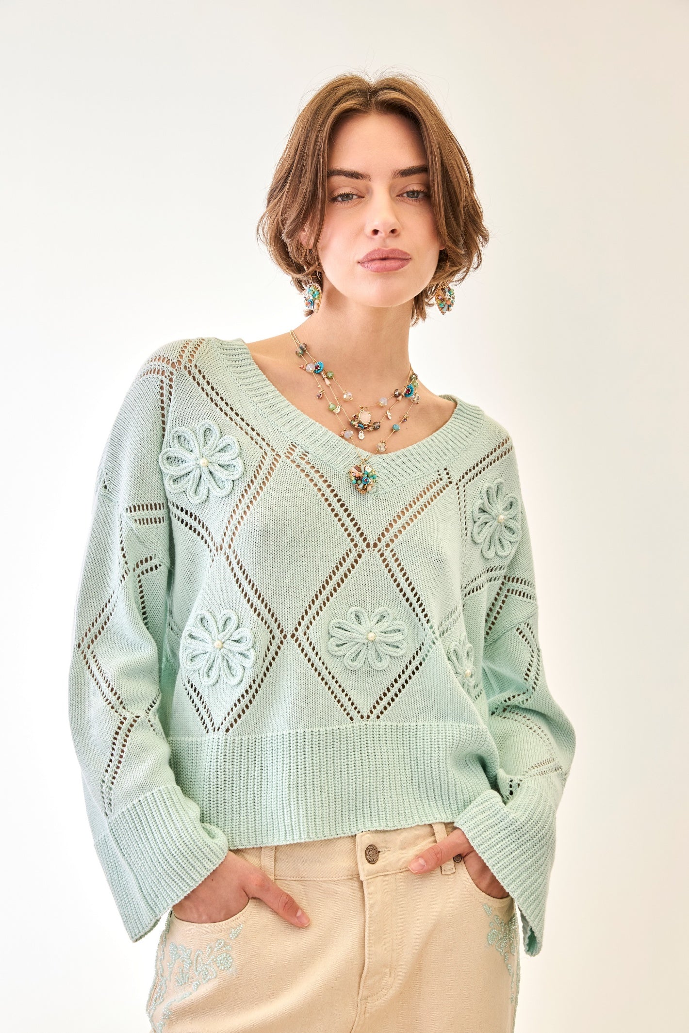 Nekane Velo Aqua V Neckline Cotton Jumper with Flowers by NKN Nekane worn by model, shop NKN Nekane at Dotique