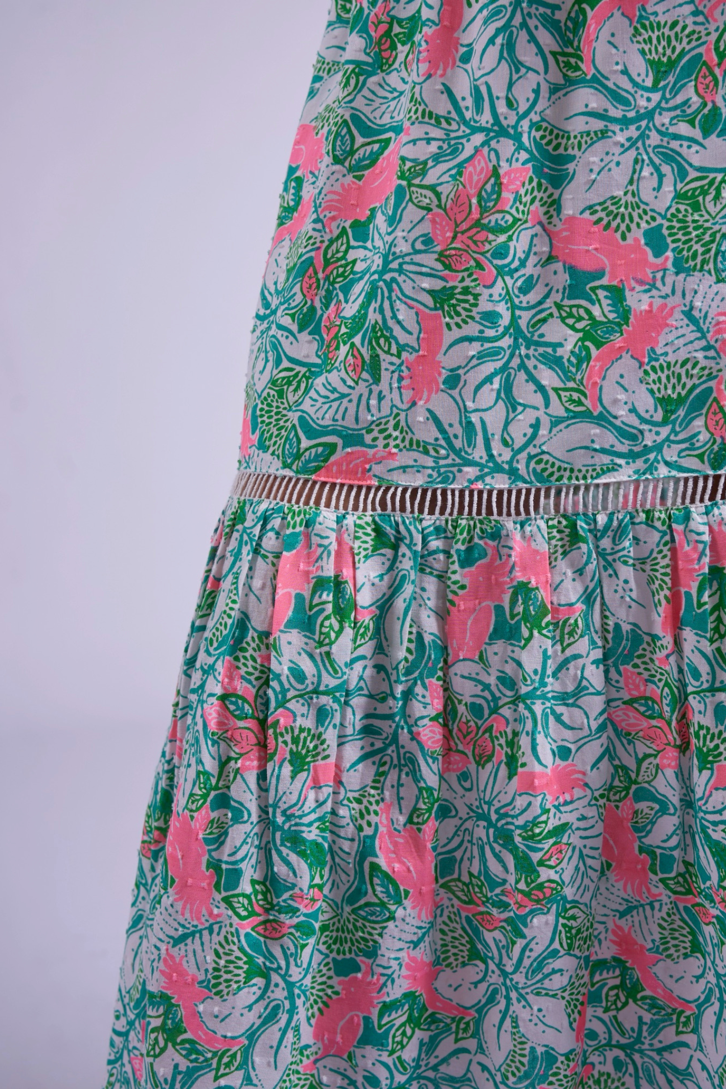 Close-up of floral print and gathered skirt detail on New Day Originals Misha Pink Parrot by New Day Originals, shop New Day Originals at Dotique