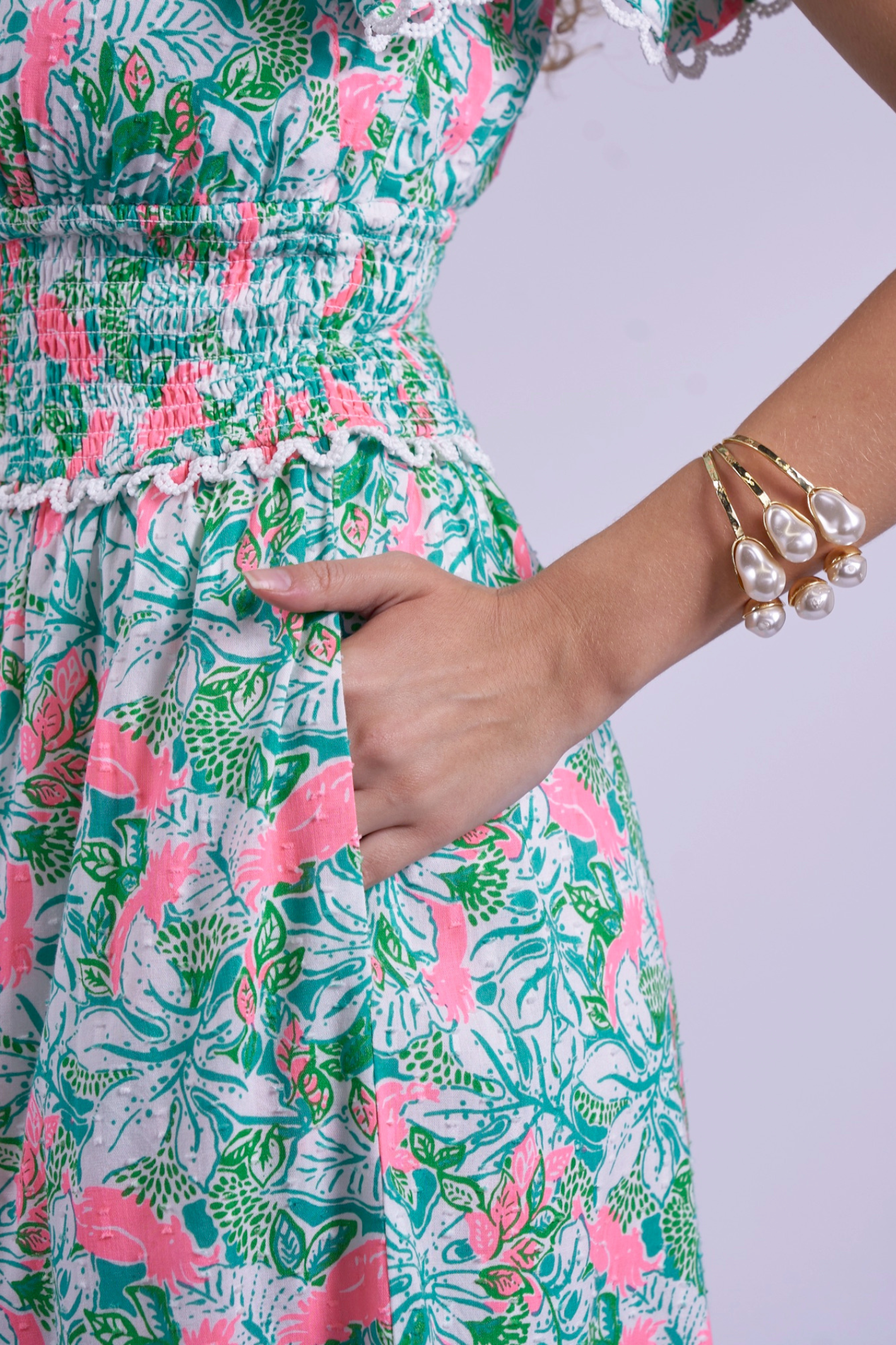 Close-up of hand in pocket of New Day Originals Misha Pink Parrot dress by New Day Originals, shop New Day Originals at Dotique