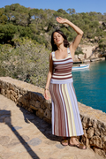 Woman wearing Nobody’s Child Multi Stripe Knit Dress in brown, blue, and cream stripes by Nobody’s Child, shop Nobody’s Child at Dotique.
