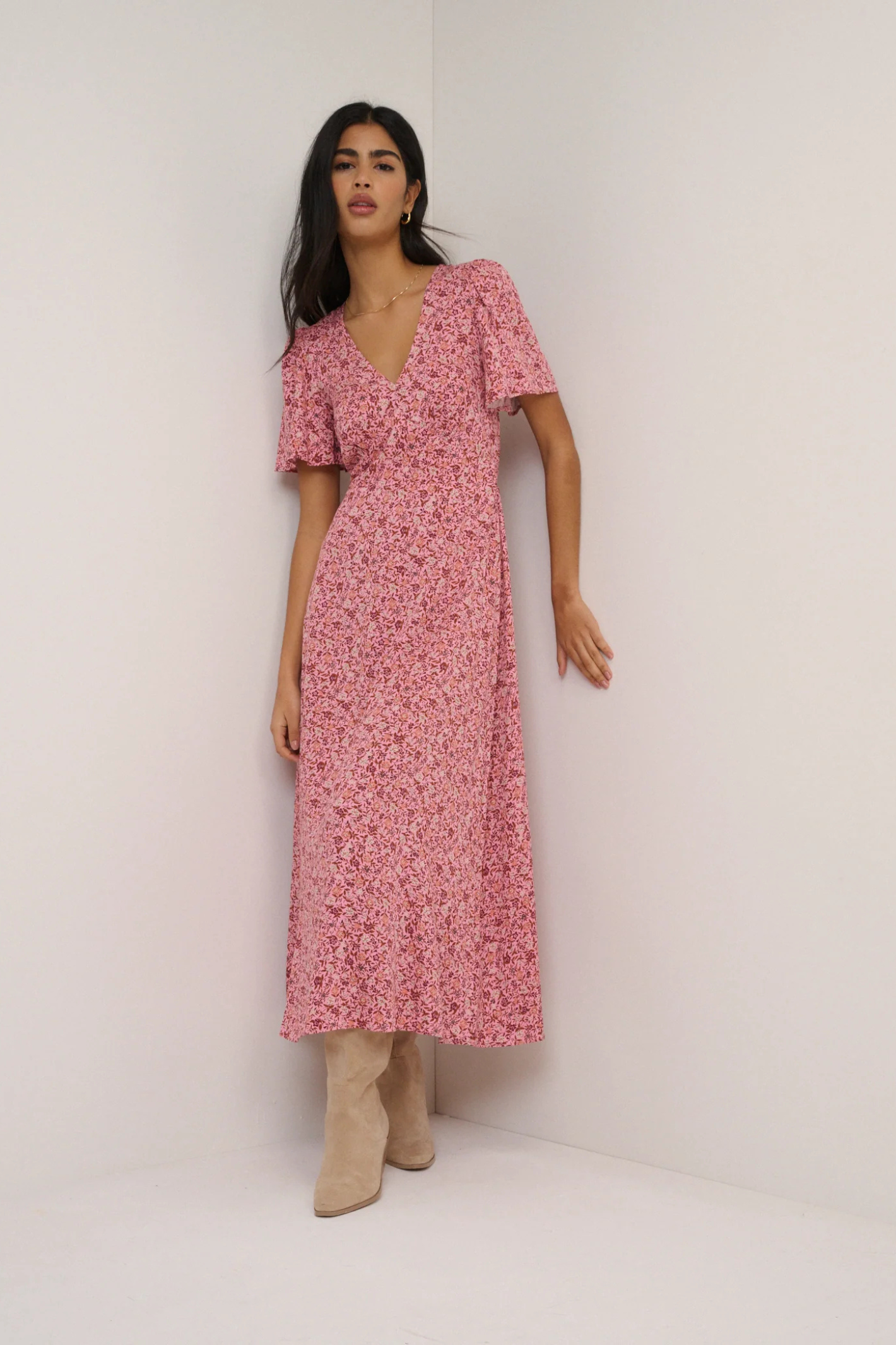 Nobody's Child Pink Floral Atlas Midi Dress by nobody’s child shown styled with boots Shop nobody’s child at Dotique