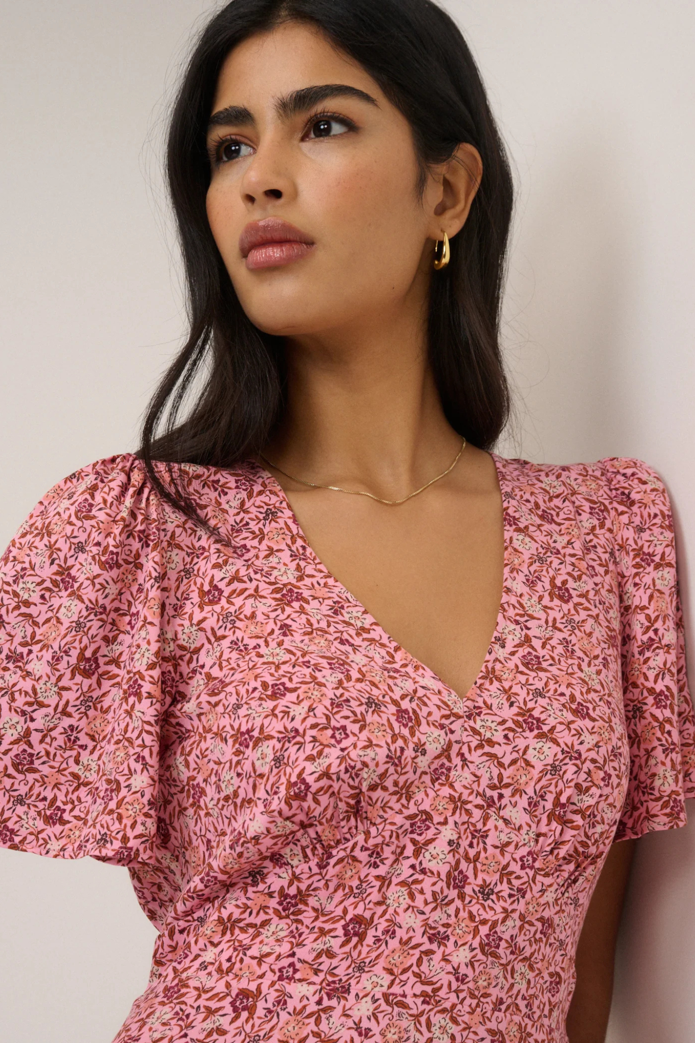 Nobody's Child Pink Floral Atlas Midi Dress by nobody’s child shown close-up with puff sleeves Shop nobody’s child at Dotique