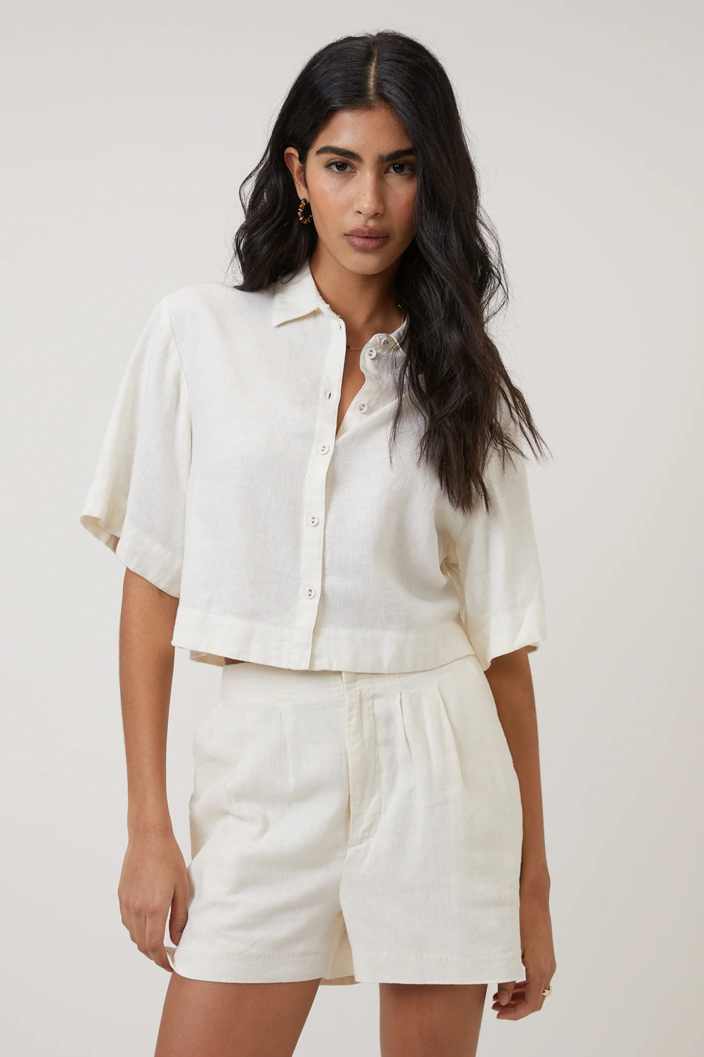 Model wearing Nobody's Child Bennie Linen Blend Cropped Shirt Cream by Nobody’s Child, shop the vendor at Dotique.