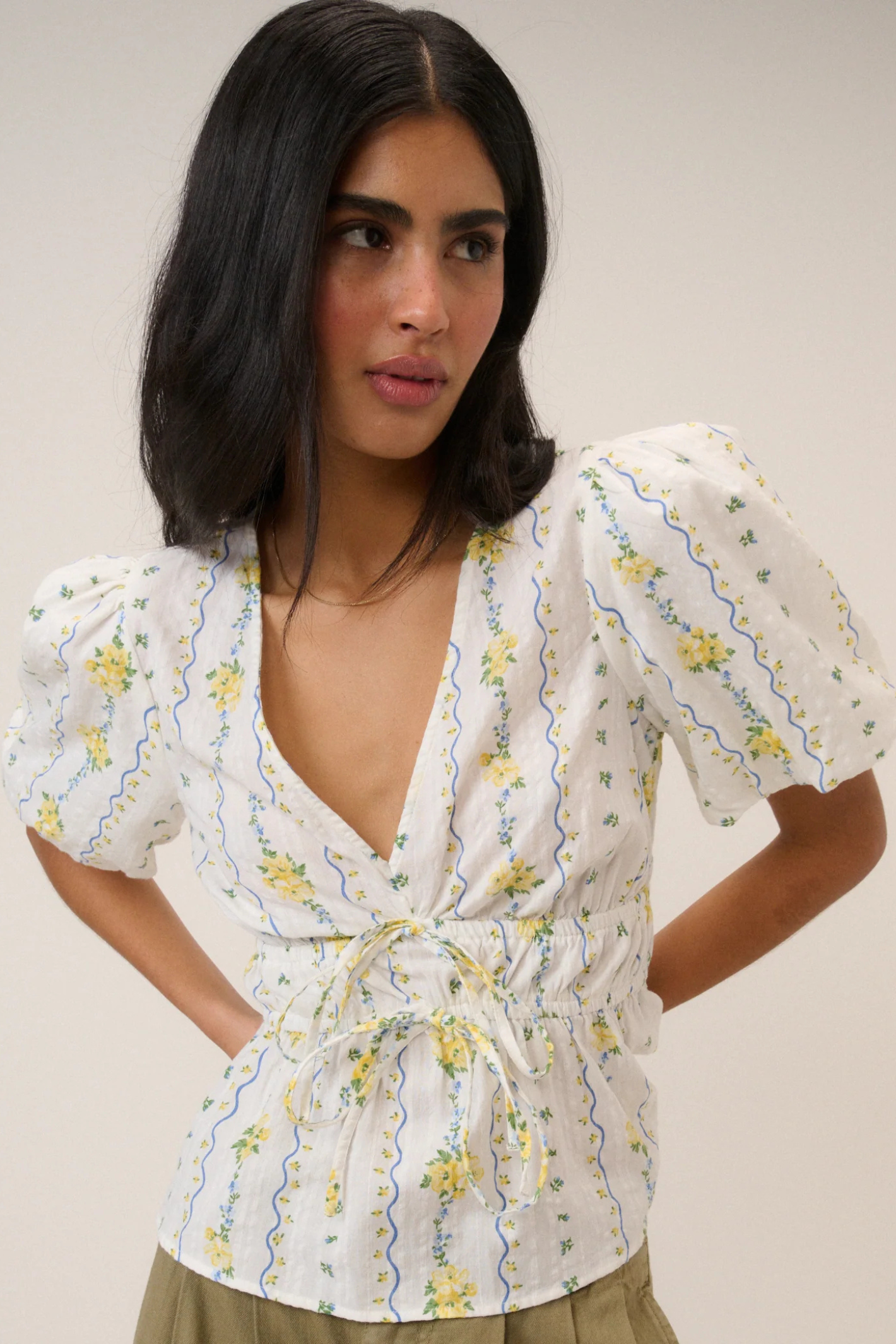 Woman wearing Nobody's Child White Ditsy Floral Cordelia Top by Nobody’s Child, shop Nobody’s Child at Dotique online store.