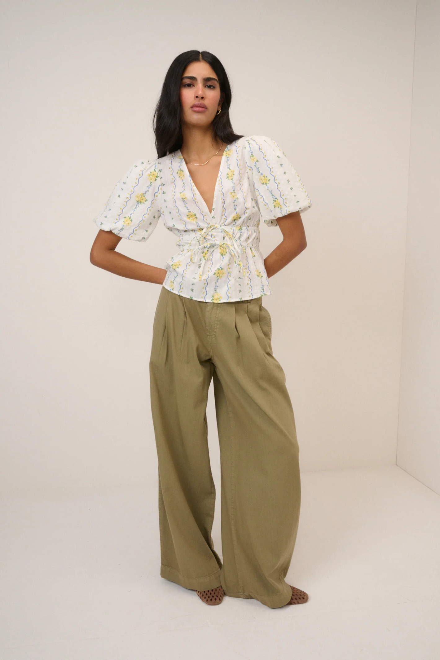 Model wearing Nobody's Child White Ditsy Floral Cordelia Top by Nobody’s Child, shop the brand at Dotique.