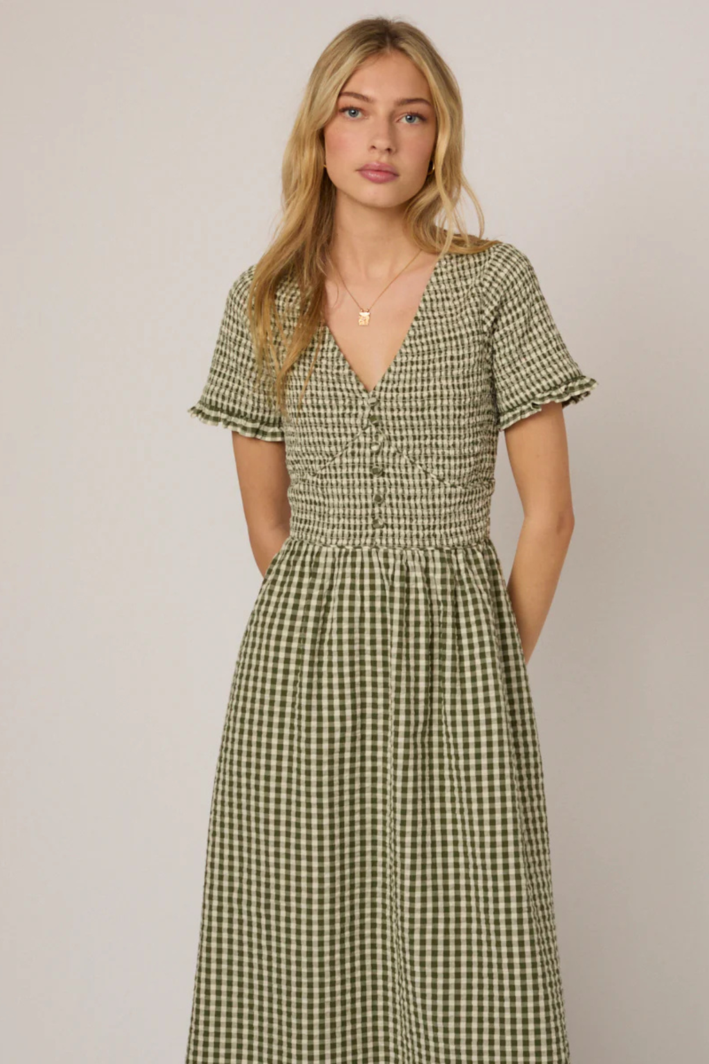 Woman wearing Nobody's Child Eliza Green Gingham Organic Cotton Midi Dress by Nobody’s Child, shop Nobody’s Child at Dotique