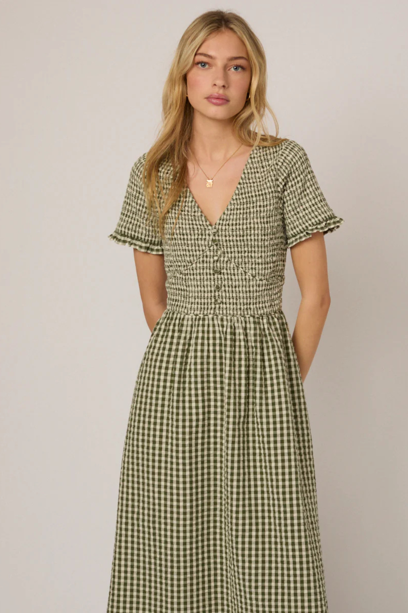 Woman wearing Nobody's Child Eliza Green Gingham Organic Cotton Midi Dress by Nobody’s Child, shop Nobody’s Child at Dotique
