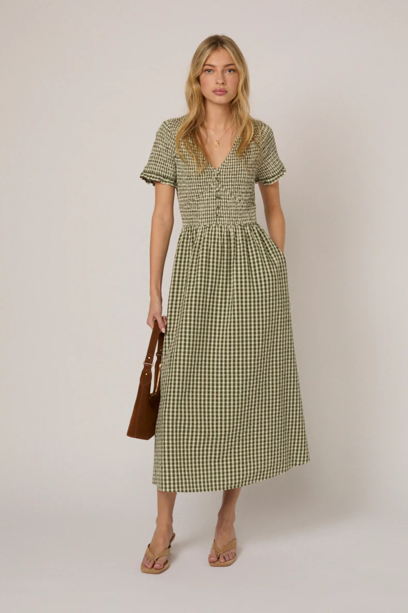 Model wearing Nobody's Child Eliza Green Gingham Organic Cotton Midi Dress by Nobody’s Child Shop at Dotique