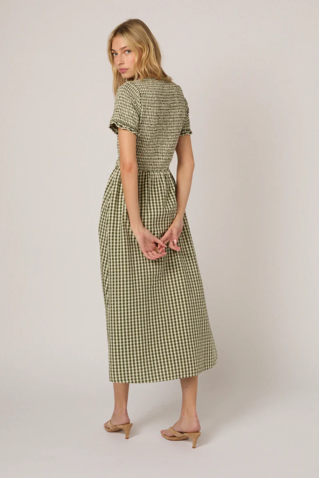 Woman wearing Nobody's Child Eliza Green Gingham Organic Cotton Midi Dress by Nobody’s Child, shop Nobody’s Child at Dotique.