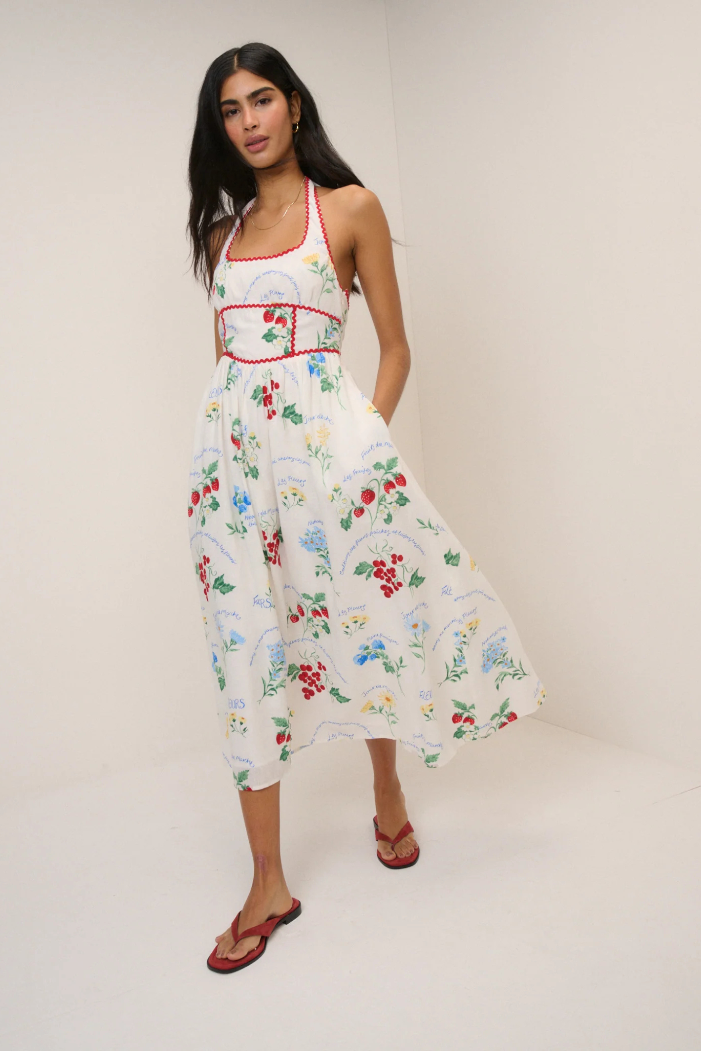 Model wearing Nobody's Child White Printed Halter Neck Hallie Midi Dress by Nobody’s Child, shop Nobody’s Child at Dotique.