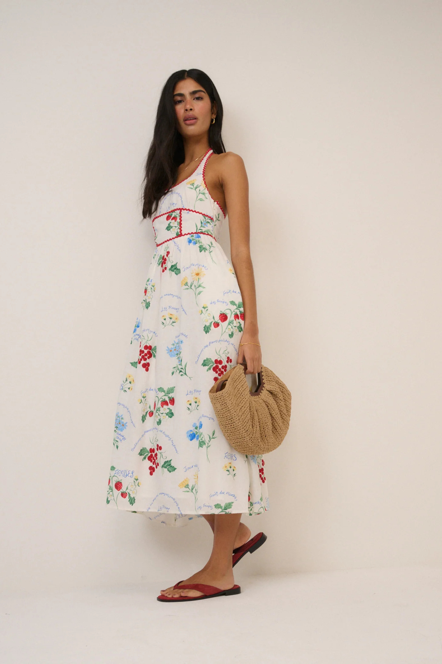 Woman wearing Nobody's Child White Printed Halter Neck Hallie Midi Dress by Nobody’s Child, shop the vendor at Dotique