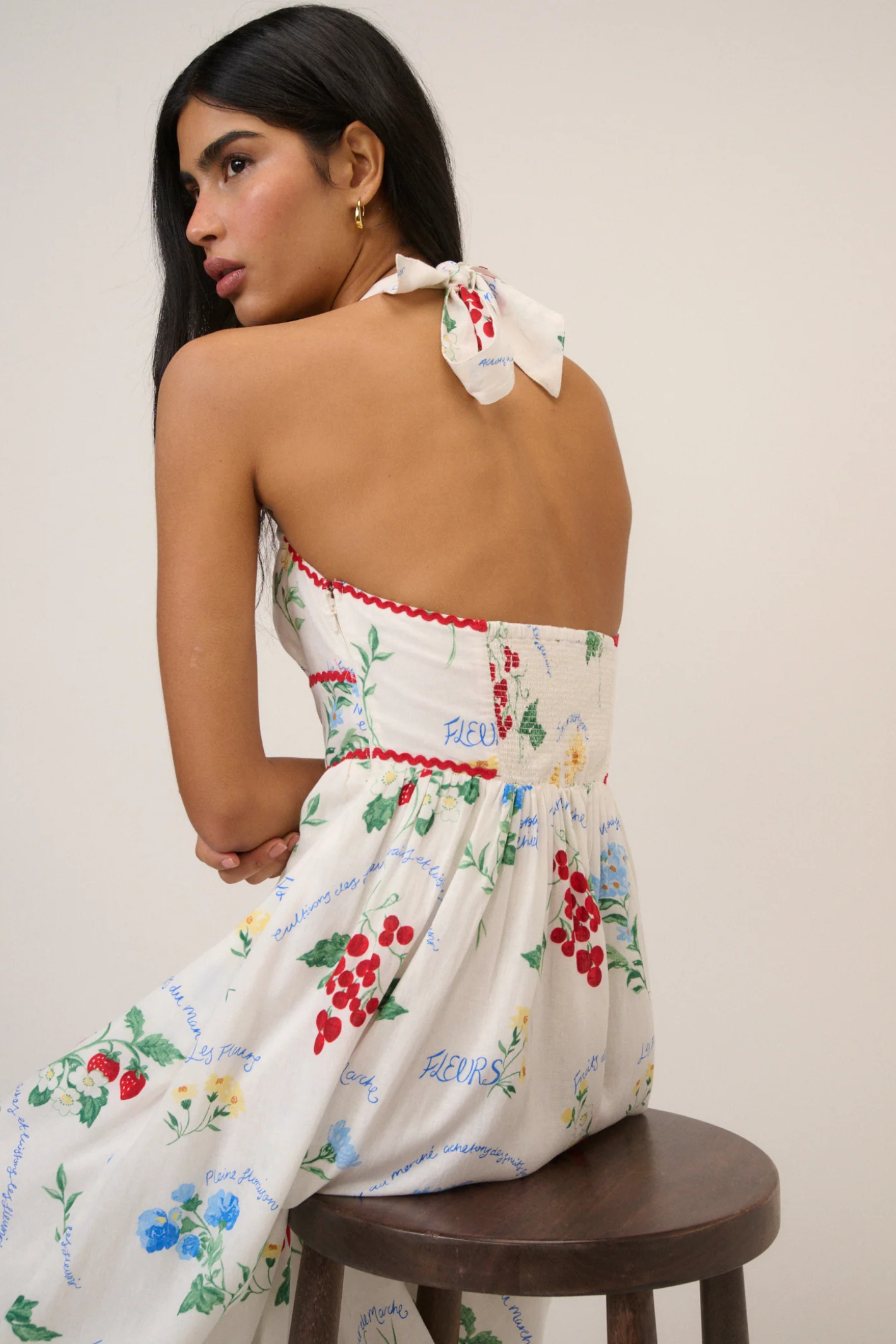 Woman wearing Nobody's Child White Printed Halter Neck Hallie Midi Dress by Nobody’s Child, shop the vendor at Dotique.