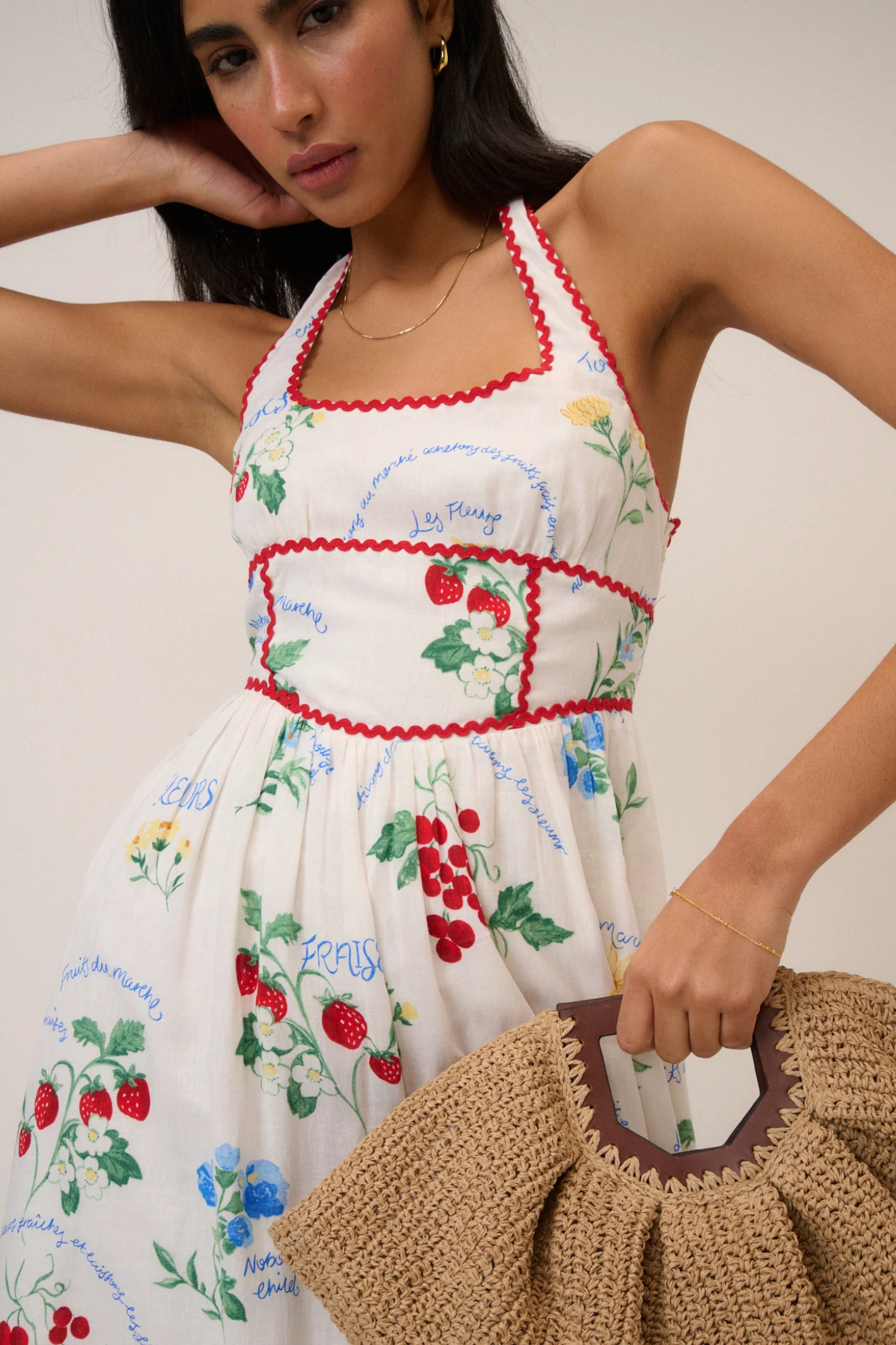 Model wearing Nobody's Child White Printed Halter Neck Hallie Midi Dress by Nobody’s Child, shop Nobody’s Child at Dotique.