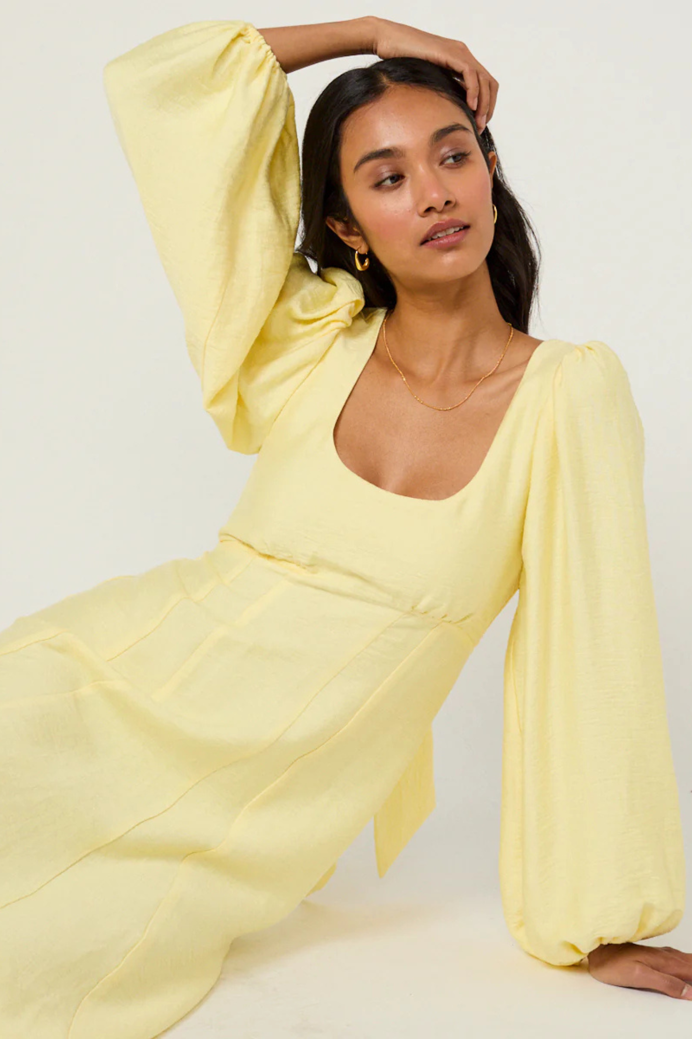 Nobody's Child Butter Yellow Bow Keyaa Midi Dress by nobody’s child worn seated with arm raised shop nobody’s child at Dotique
