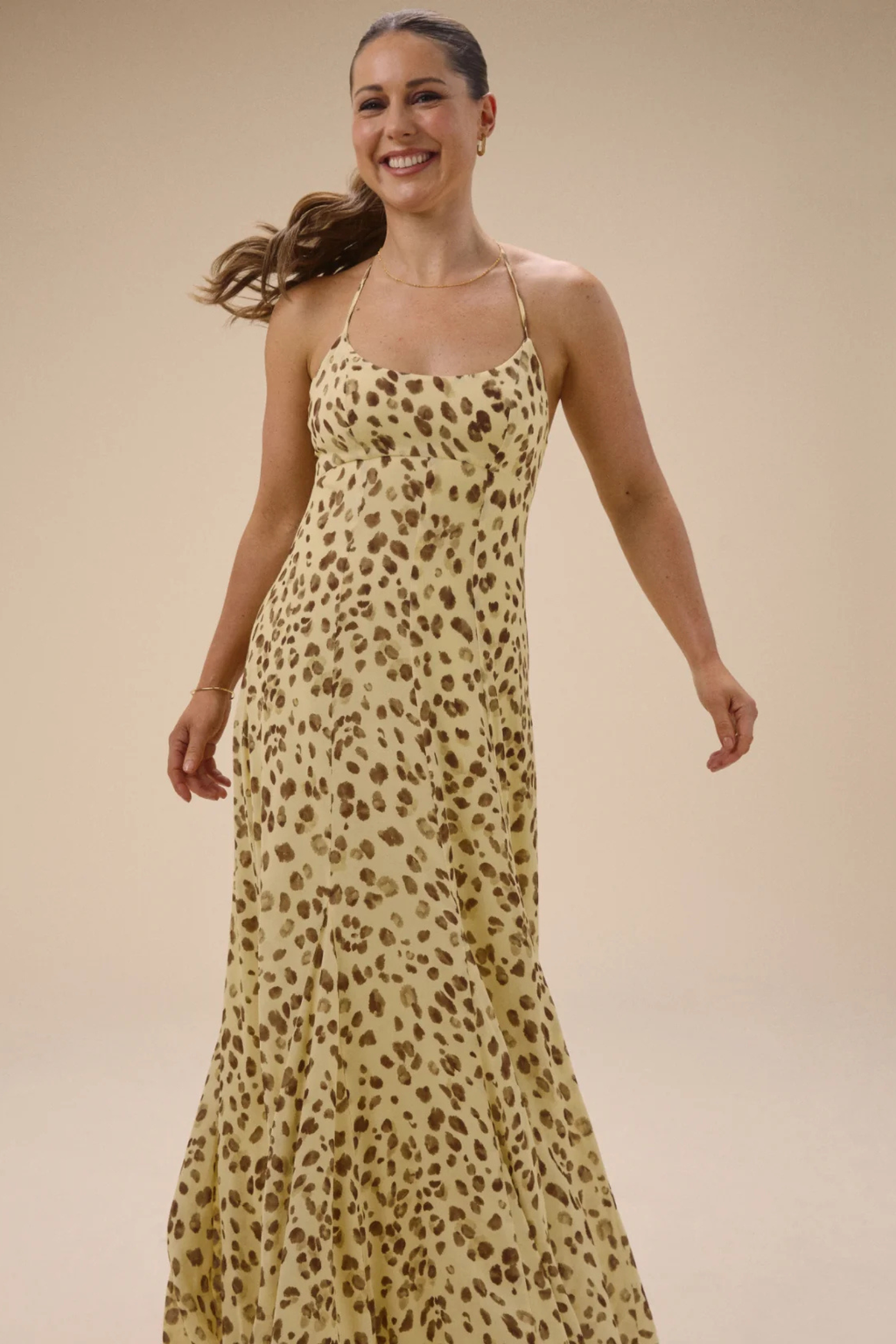 Woman smiling wearing Nobody's Child Kiki Midaxi Dress Butter Yellow Leopard Print by Nobody’s Child Shop at Dotique