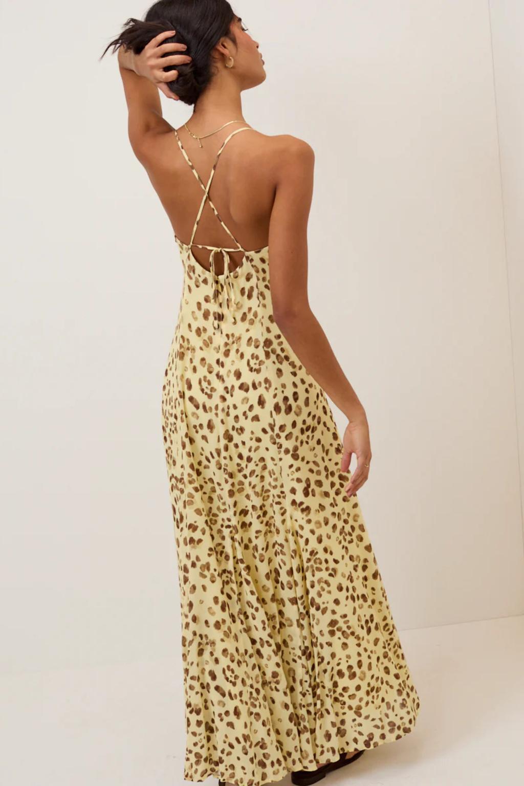 Woman wearing Nobody's Child Kiki Midaxi Dress Butter Yellow Leopard Print by Nobody’s Child, shop Nobody’s Child at Dotique.