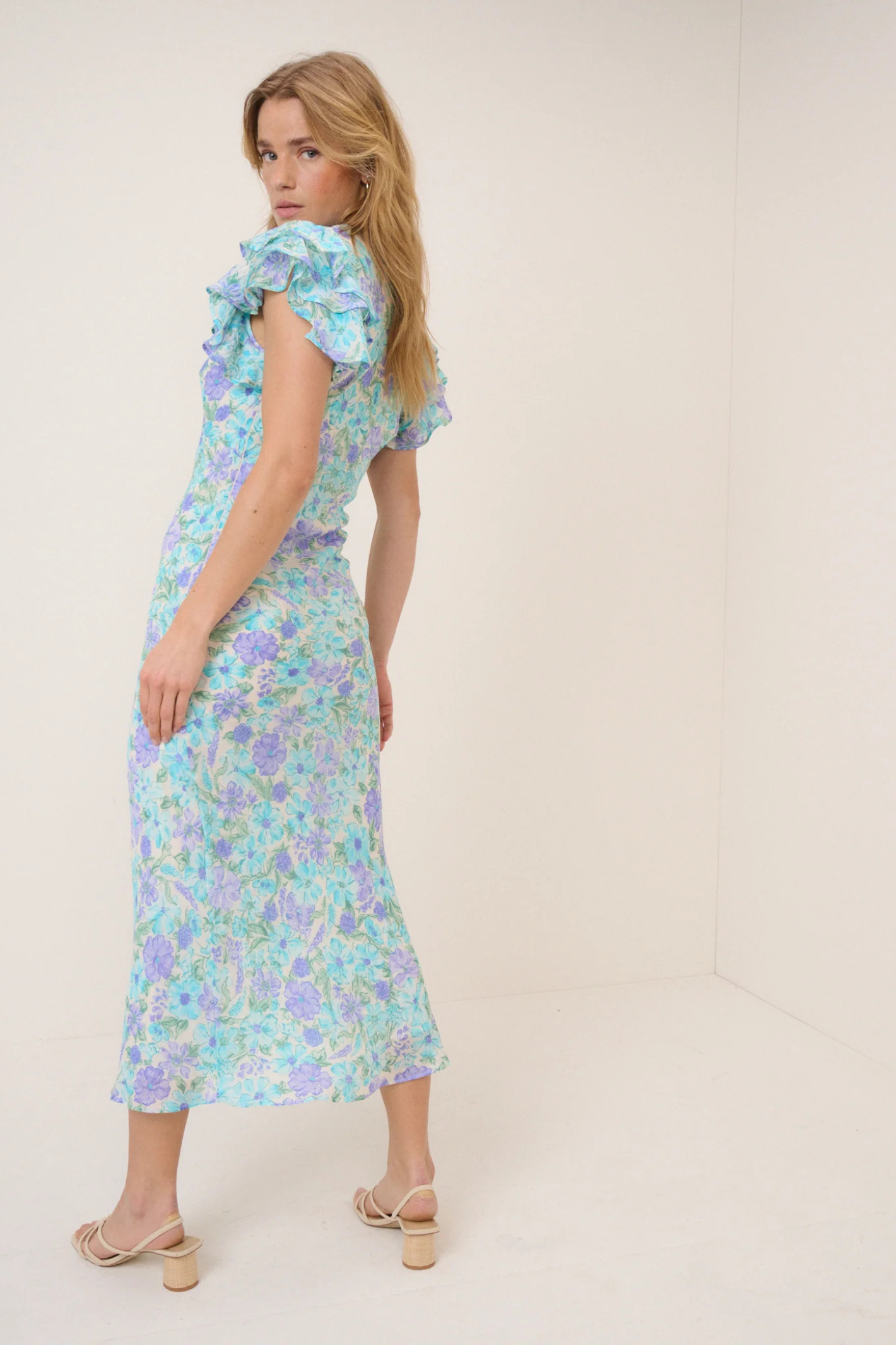 Nobody's Child Blue Floral Layla Midi Dress by nobody’s child with ruffle sleeves and floral print Shop nobody’s child at Dotique