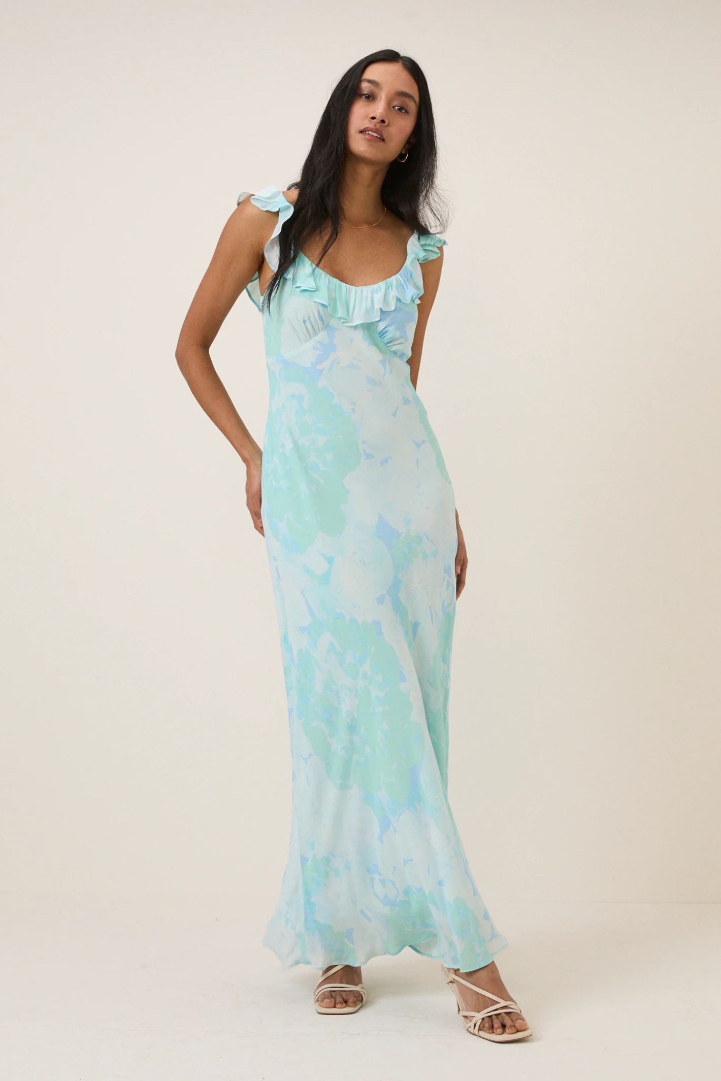 Model wearing Nobody's Child Blue Floral Chiffon Logan Midi Dress by Nobody’s Child, shop Nobody’s Child at Dotique.